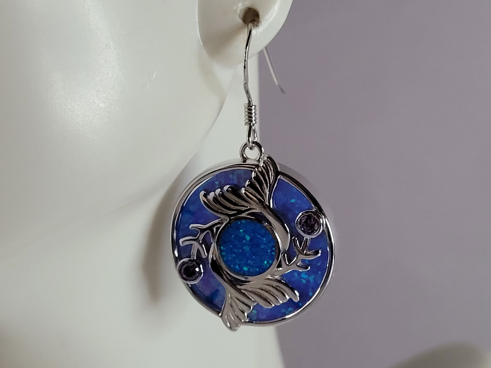 Womens Sterling Silver Blue Opal Mermaid Tail Earrings: A WOMENS ESTATE STERLING SILVER BLUE OPAL MERMAID EARRINGS. NOT SURE IF STONES ARE REAL OR MAN MADE. THE EARRINGS WEIGH 9.0g AND MEASURES 1 3/8" LONG BY 3/4" WIDE. MAKES A GREAT GIFT FOR THAT SOMEONE