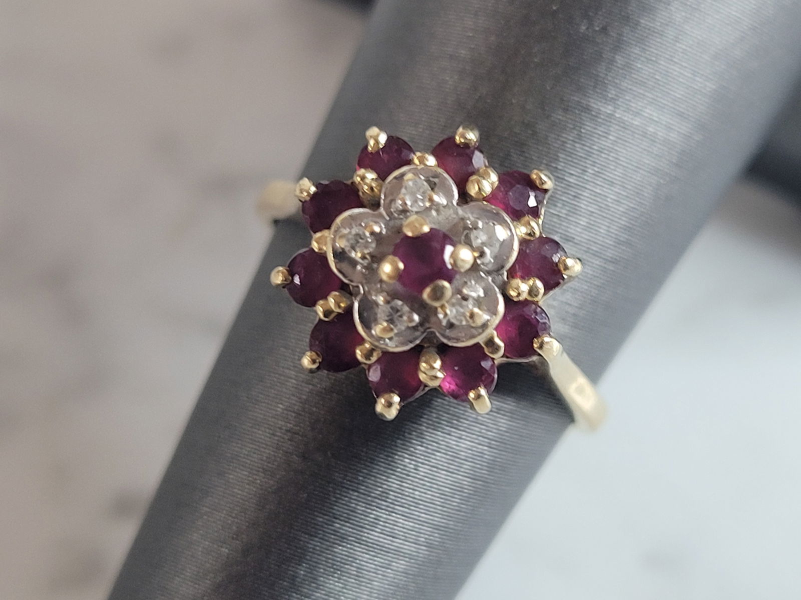 Womens Vintage Estate 14k Yellow Gold Ruby & Diamond Ring: A WOMENS VINTAGE ESTATE 14K GOLD RUBY & DIAMOND RING. RING IS MARKED ON THE INSIDE "14K". THE SIZE OF THE RING IS A 6.0. RING WEIGHS 3.1g AND MEASURES 3/8" WIDE. THERE ARE ABOUT .05cts OF DIAMONDS. AN