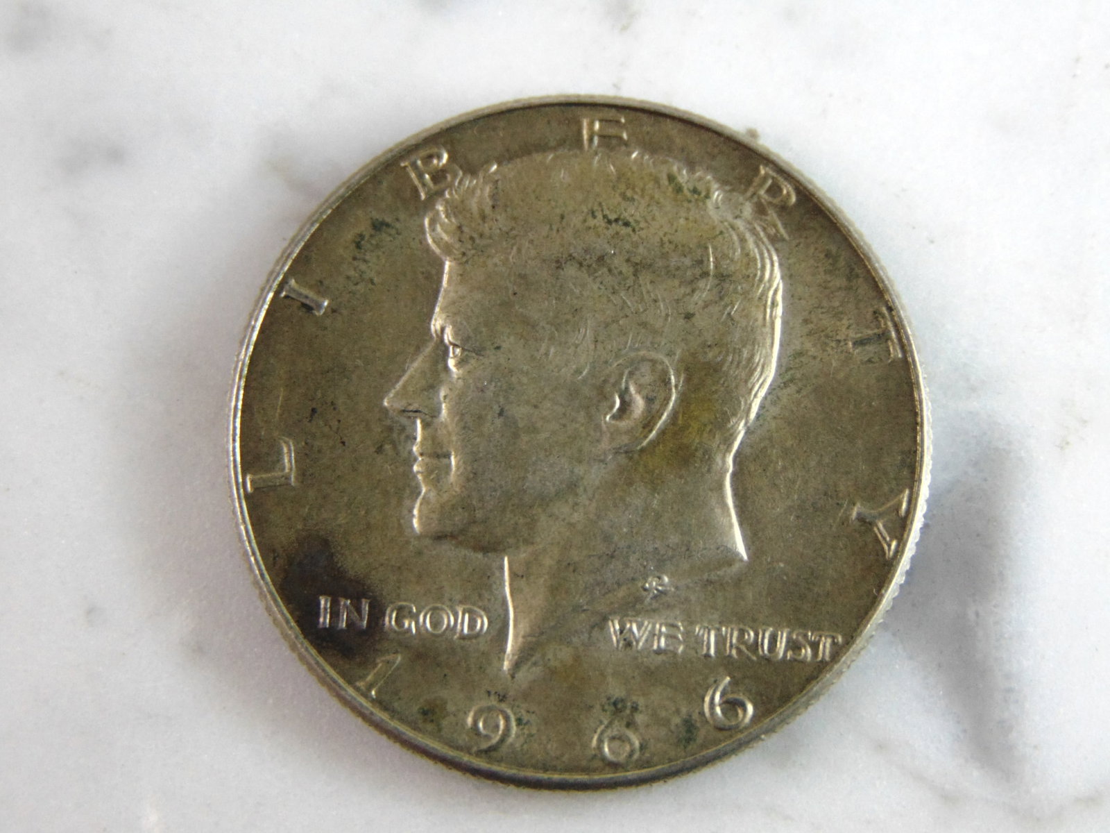 1966 Kennedy Half Dollar Coin: FOR SALE IS THIS 1966 KENNEDY HALF DOLLAR COIN. WE ARE NOT COIN EXPERTS WHEN IT COMES TO PROPER GRADING. PICTURES SHOULD BE CLEAR ENOUGH TO SEE ANY KIND OF BLEMISHES. BUYING AS IS. WOULD MAKE A GREAT