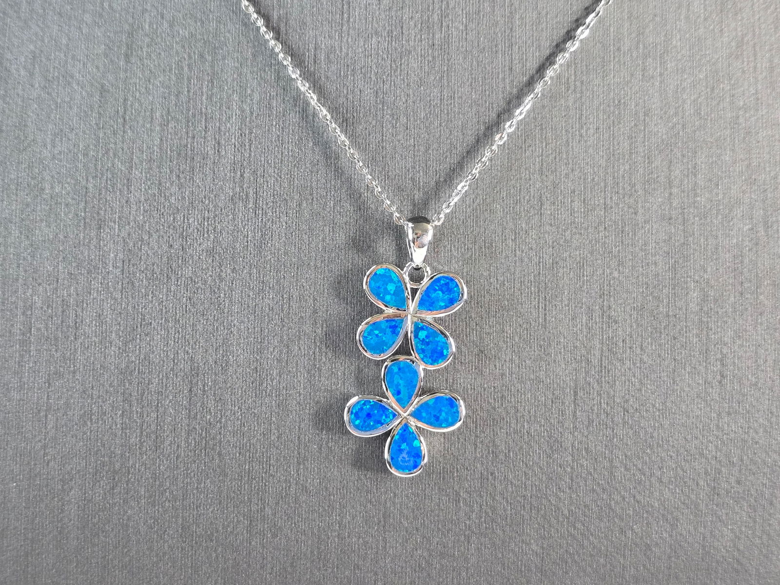 Womens Sterling Silver Blue Opal Modernist Daisy Flower Pendant Necklace: A WOMENS STERLING SILVER BLUE OPAL MODERNIST DAISY FLOWER PENDANT. THE PENDANT WITH NECKLACE WEIGHS 4.8g. PENDANT MEASURES 1 1/2" LONG BY 1/2" WIDE, AND THE NECKLACE MEASURES 18" LONG, ADJUSTABLE TO 1