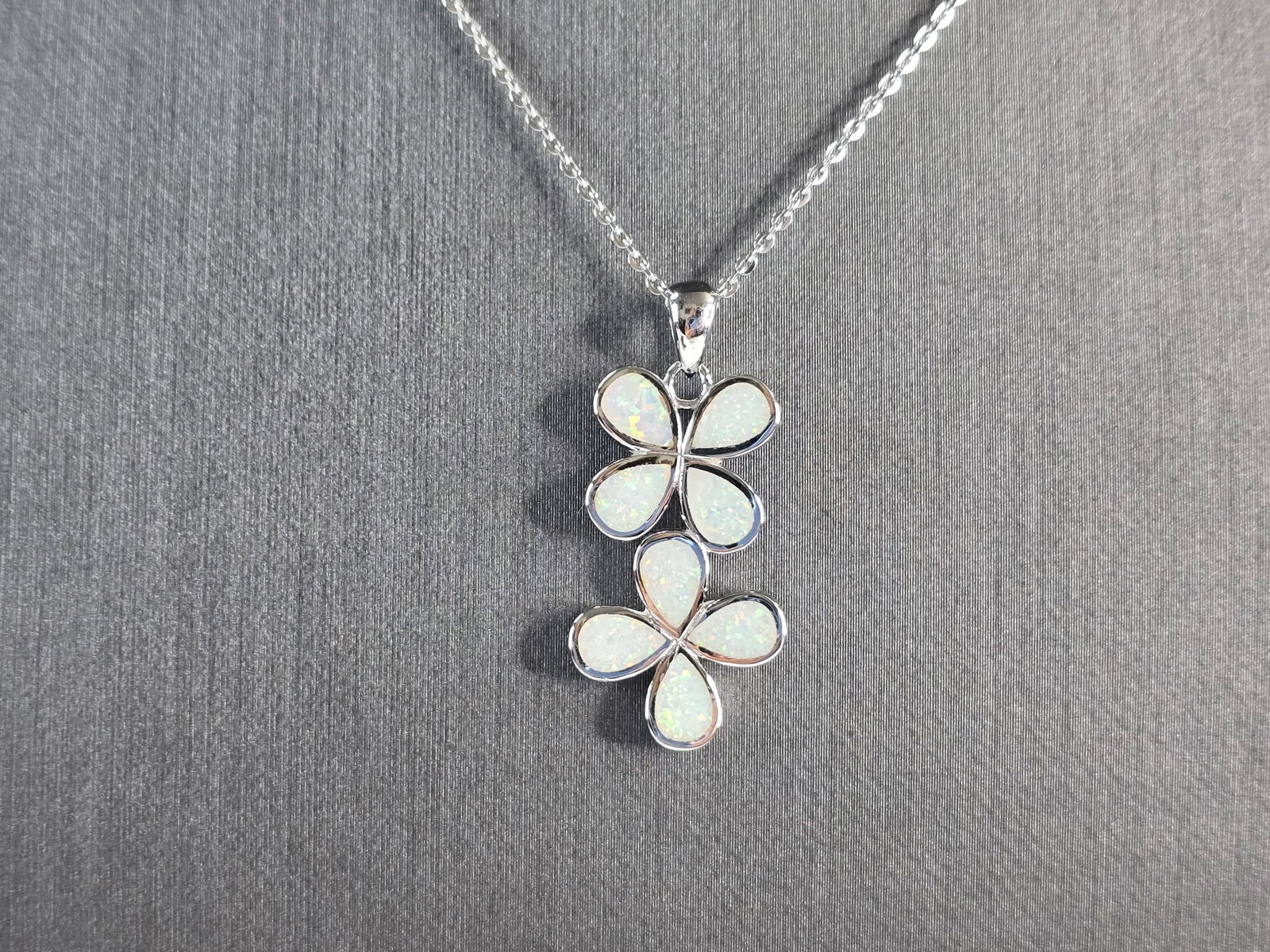 Womens Sterling Silver Opal Modernist Daisy Flower Pendant Necklace: A WOMENS STERLING SILVER OPAL MODERNIST DAISY FLOWER PENDANT. THE PENDANT WITH NECKLACE WEIGHS 4.8g. PENDANT MEASURES 1 1/2" LONG BY 1/2" WIDE, AND THE NECKLACE MEASURES 18" LONG, ADJUSTABLE TO 16". N