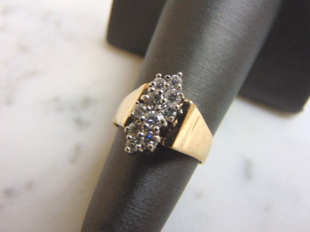 Womens Vintage 14k Gold Exquisite Diamond Cluster Ring: FOR SALE IS THIS WONDERFUL 14K GOLD & DIAMOND CLUSTER RING, MADE BY EXQUISITE. THE RING WEIGHS 4.2g. THE SIZE OF THE RING IS A 4.75. THERE ARE ABOUT .70cts OF DIAMONDS AND THE FACE IS ABOUT 1/2" WIDE.