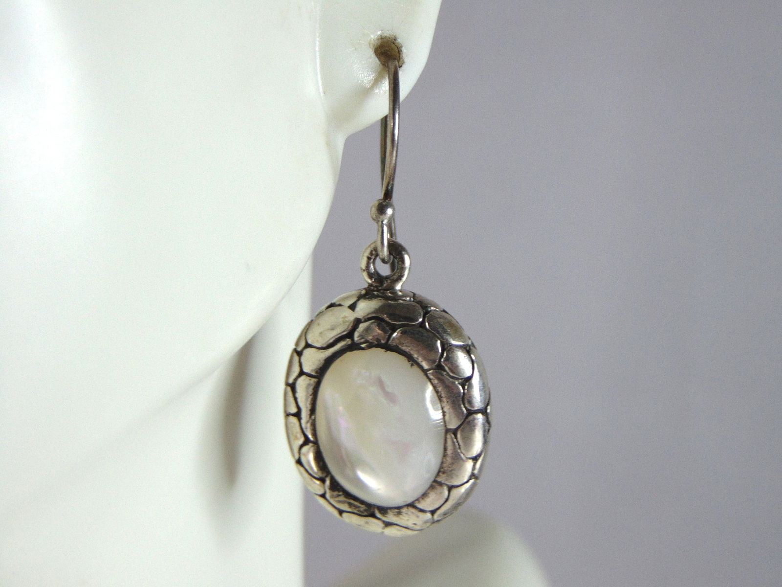Womens Vintage Estate Sterling Silver M.O.P. Dangle Earrings: WOMENS VINTAGE ESTATE STERLING SILVER MOTHER OF PERAL EARRINGS THAT WEIGHS 9.2g AND MEASURES 1 3/8" LONG BY 5/8" WIDE. NOT SURE IF STONE IS NATURAL OR MAN MADE. ANY OTHER QUESTIONS, PLEASE DO NOT HESI
