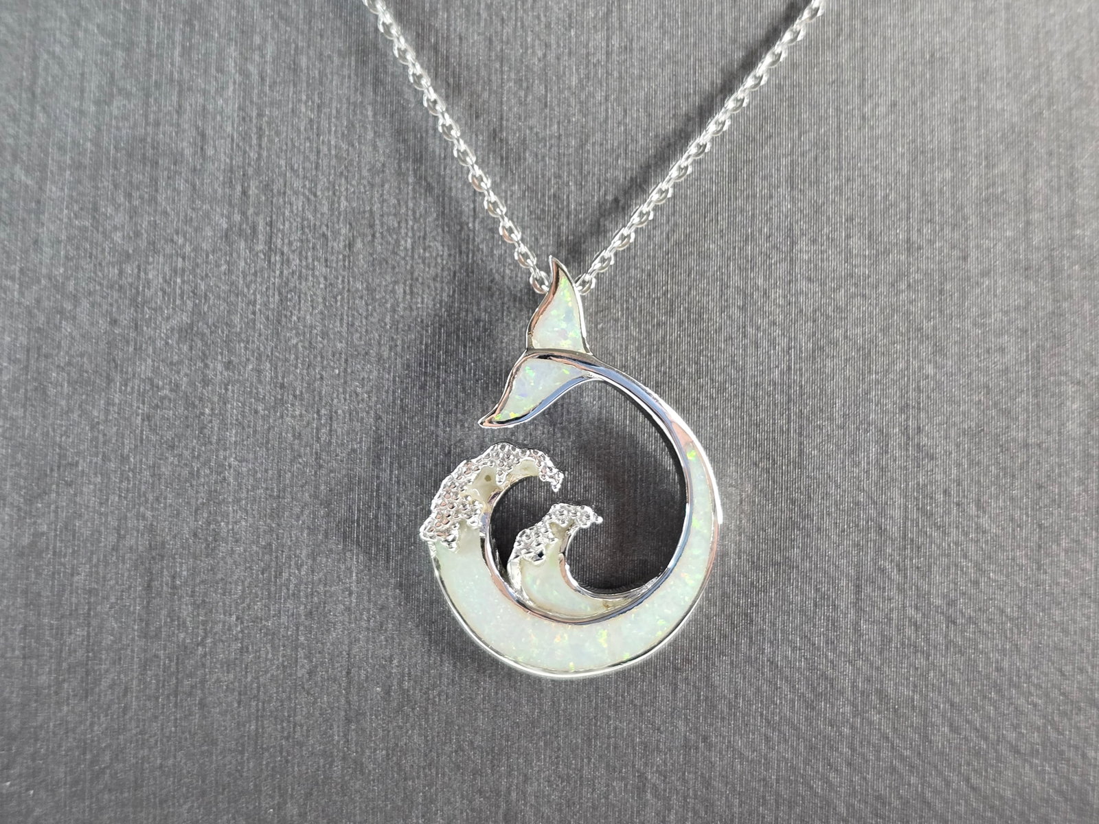 Womens Sterling Silver Opal Modernist Whale Pendant Necklace: A WOMENS STERLING SILVER OPAL MODERNIST WHALE PENDANT WITH NECKLACE. THE PENDANT WITH NECKLACE WEIGHS 5.0g. PENDANT MEASURES 1 1/8" LONG BY 3/4" WIDE, AND THE NECKLACE MEASURES 18" LONG, ADJUSTABLE TO