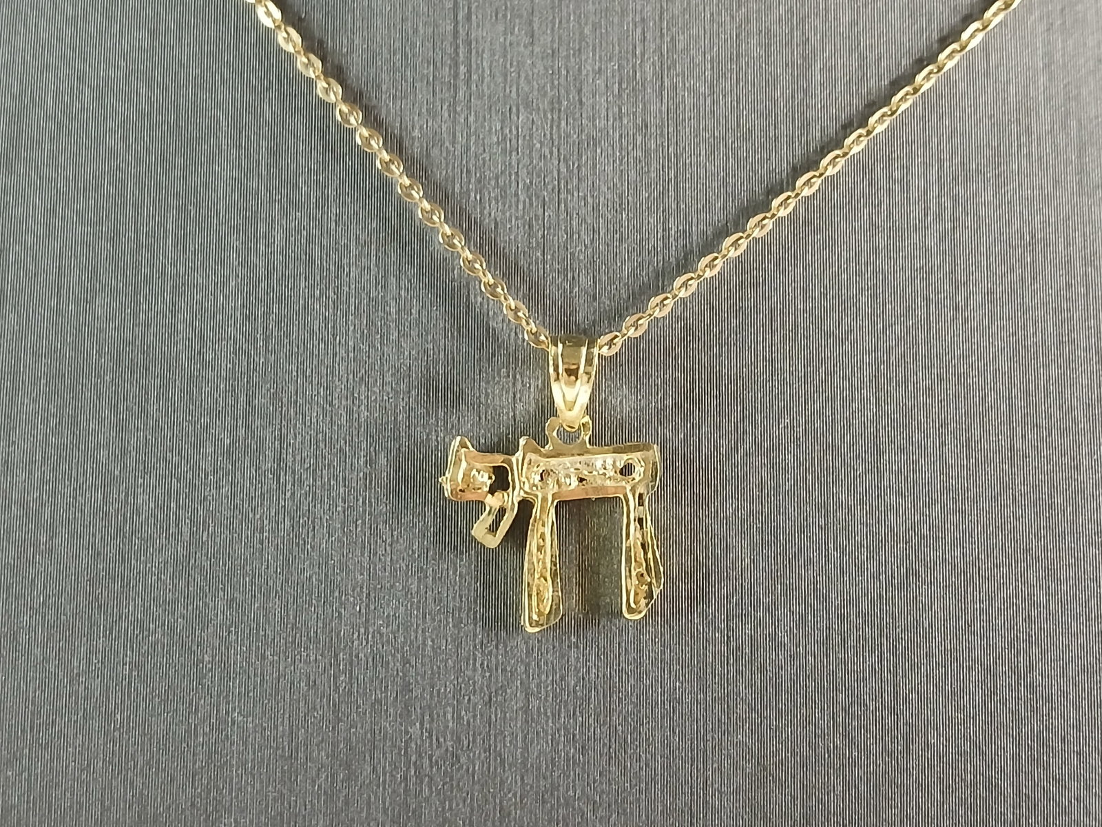 Womens Sterling Silver Gold Tone Jewish Hebrew Chai Pendant Necklace: A STERLING SILVER GOLD TONE JEWISH HEBREW CHAI OR LIFE PENDANT WITH NECKLACE. PENDANT WITH THE NECKLACE WEIGHS 2.1g. PENDANT MEASURES 1/2" LONG BY 1/2" WIDE, AND THE NECKLACE MEASURES 18" LONG, ADJUST
