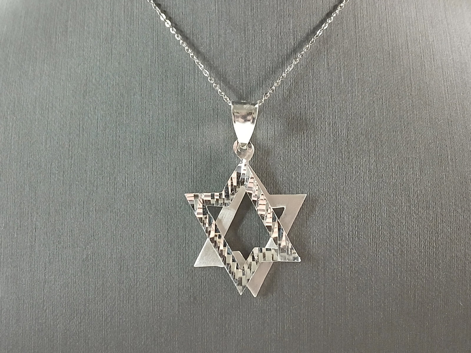Womens Sterling Silver Modernist Star of David Pendant Necklace: A WOMENS STERLING SILVER MODERNIST 2PC STAR OF DAVID PENDANT WITH NECKLACE. PENDANT WITH NECKLACE WEIGHS 7.3g. THE PENDANT MEASURES 1 3/4" LONG BY 1" WIDE. THE NECKLACE MEASURES 18" LONG, ADJUSTABLE T