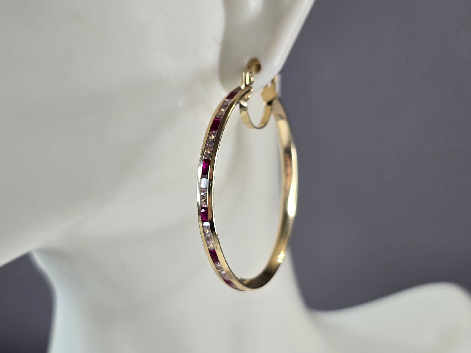 Womens 14K Yellow Gold Ruby & CZ Hoop Earrings: A LOVELY PAIR OF WOMENS 14K YELLOW GOLD RUBY & CZ HOOP EARRINGS . THE EARRINGS WEIGH 4.5g, AND MEASURE 1 1/2" LONG BY 1 3/8" WIDE. NOT SURE IF STONES ARE NATURAL OR MAN MADE. ANY QUESTIONS, PLEASE DON