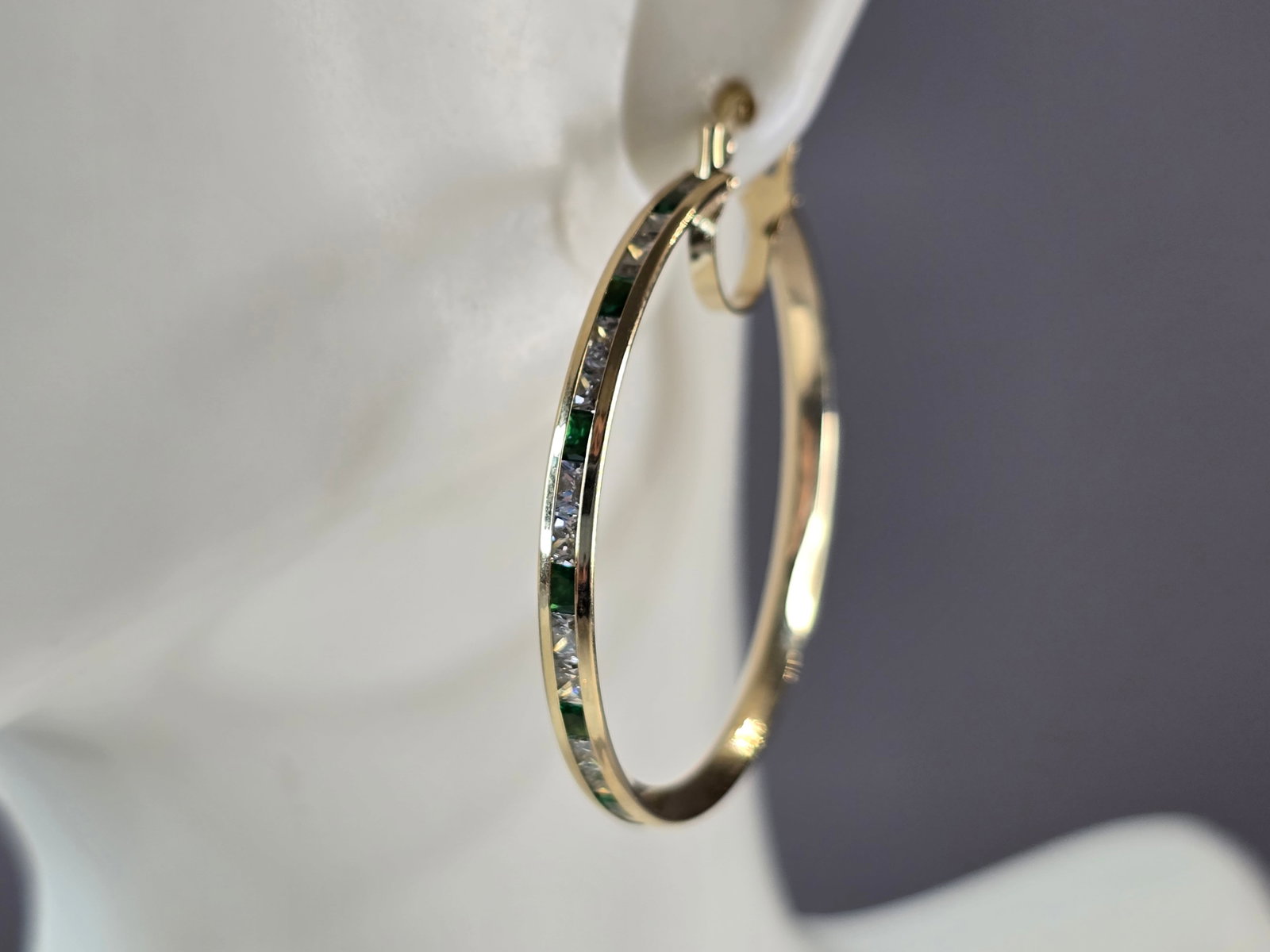 Womens 14K Yellow Gold Emerald & CZ Hoop Earrings: A LOVELY PAIR OF WOMENS 14K YELLOW GOLD EMERALD & CZ HOOP EARRINGS. THE EARRINGS WEIGH 4.5g, AND MEASURE 1 1/2" LONG BY 1 3/8" WIDE. NOT SURE IF STONES ARE NATURAL OR MAN MADE. ANY QUESTIONS, PLEASE D
