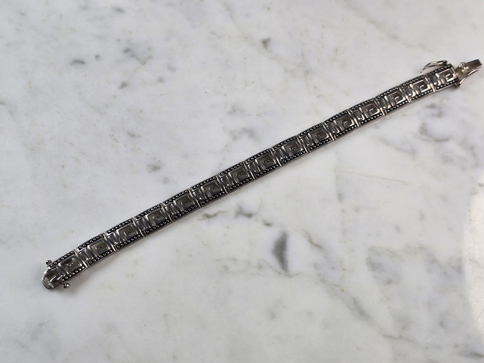 Womens Vintage Estate Sterling Silver Modernist Greek Key Bracelet: A WOMENS VINTAGE ESTATE STERLING SILVER MODERNIST GREEK KEY BRACELET. THE BRACELET WEIGHS 16.4g, AND MEASURES 7 1/8" BY 5/16". THE BRACELET MAKES A BEAUTIFUL GIFT FOR THAT SOMEONE SPECIAL. ANY QUESTIO