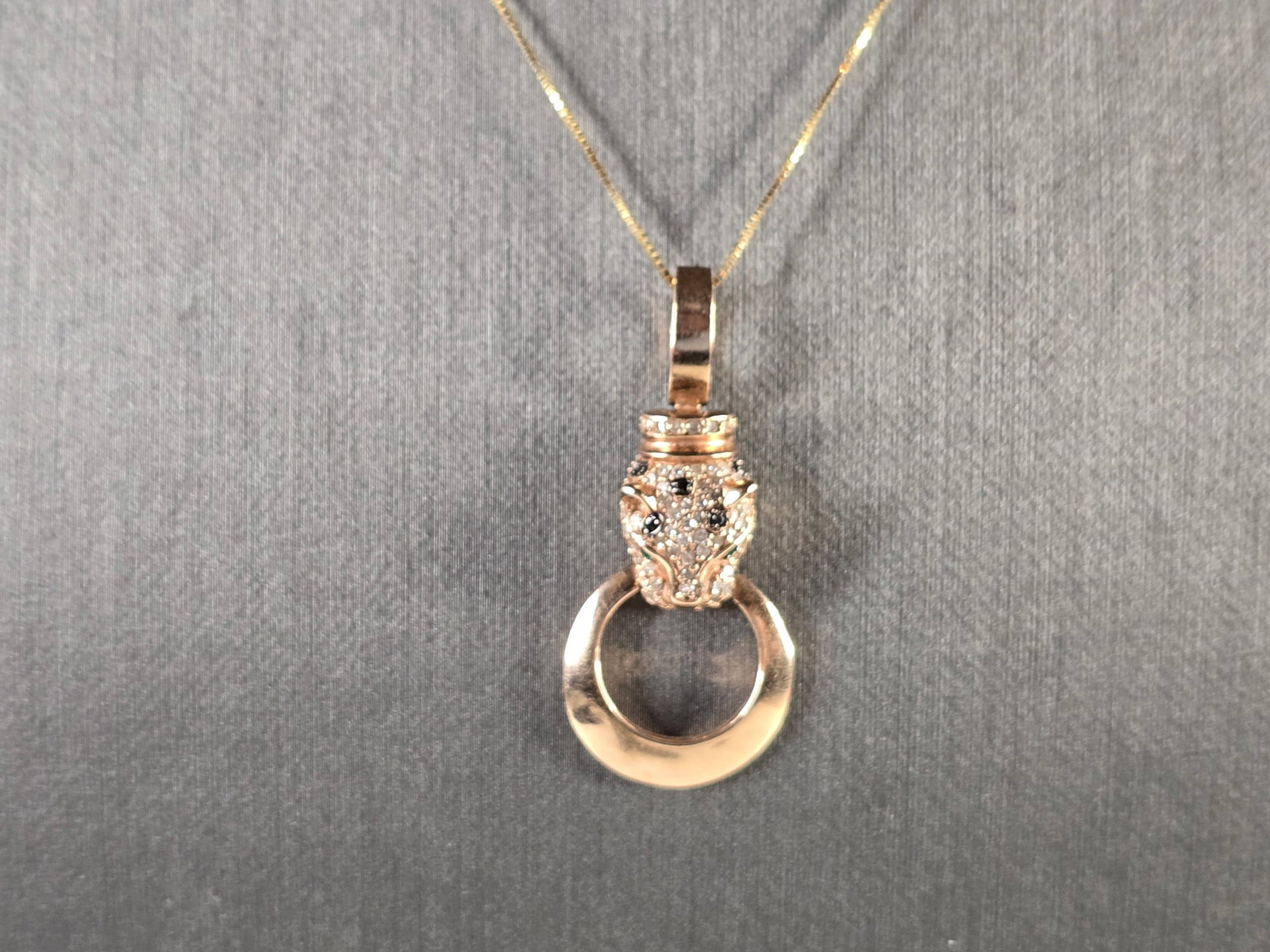 Womens 14K Yellow & Rose Gold Diamond Panther Pendant Necklace: A WOMENS VINTAGE ESTATE 14K YELLOW & ROSE GOLD DIAMOND PANTHER PENDANT. THE TOTAL WEIGHT IS 5.6g. THERE ARE ABOUT 60 TINY DIAMONDS IN THIS PENDANT, ONE DIAMOND IS MISSING IN THE EAR. THE PENDANT MEASU