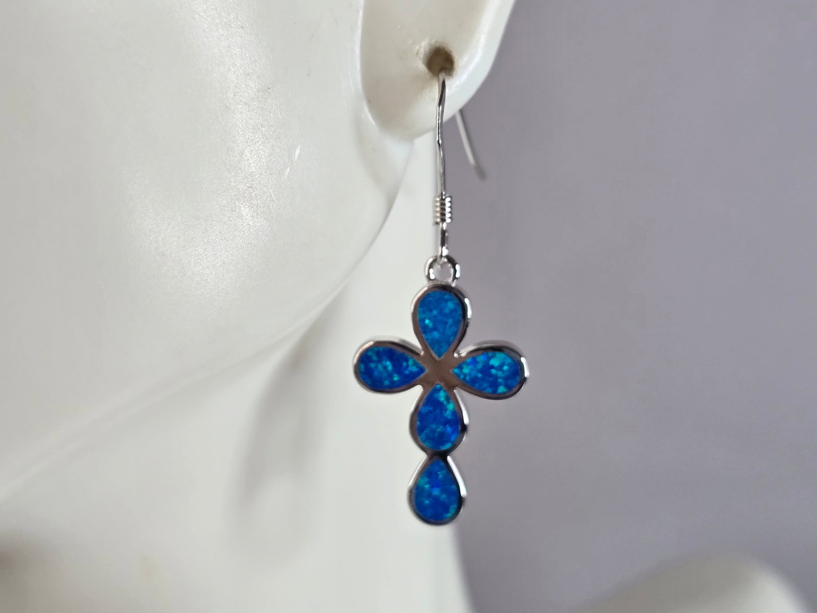 Womens Estate Sterling Silver Blue Opal Cross Earrings: A PAIR OF WOMENS STERLING SILVER BLUE OPAL COLORED CROSS EARRINGS THAT WEIGH 4.3g AND MEASURES 1 3/8" LONG BY 1/2" WIDE. NOT SURE IF STONES ARE REAL OR MAN MADE. ANY QUESTIONS, PLEASE DO NOT HESITATE