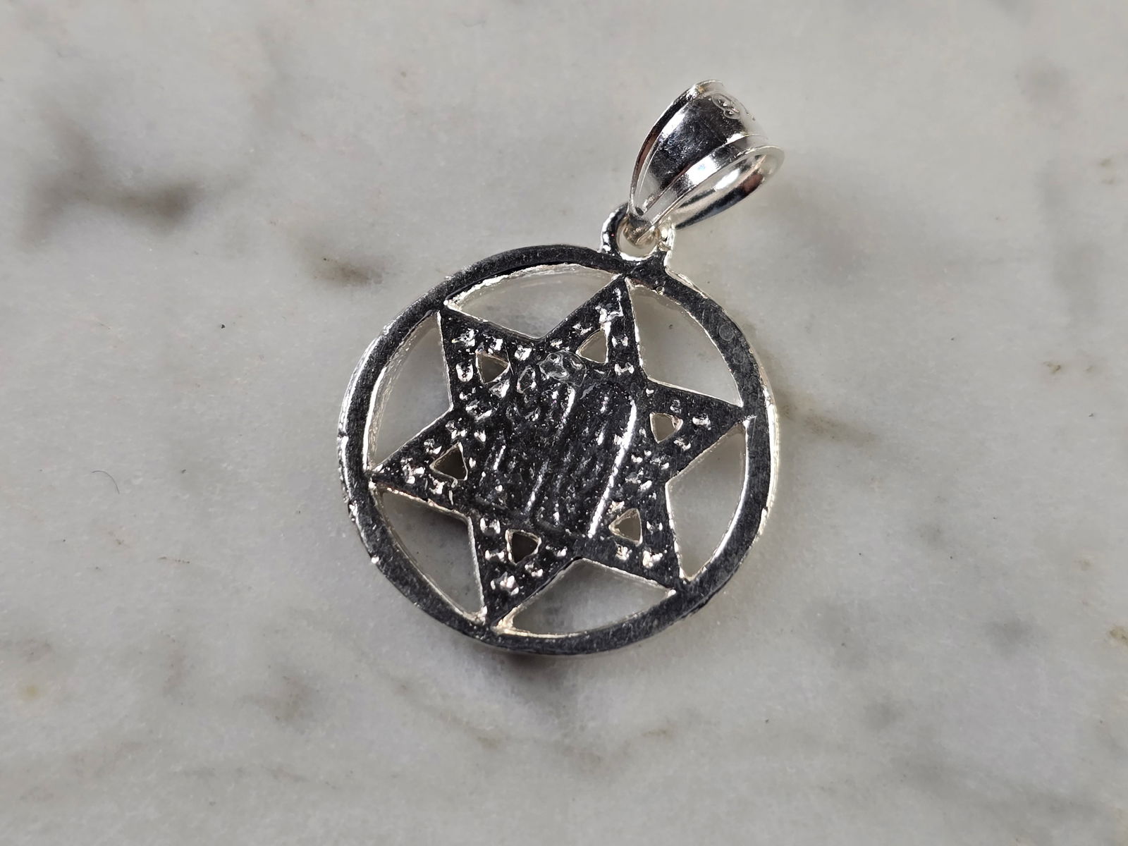 Sterling Silver Jewish Judaica Star of David Torah Pendant: A STERLING SILVER STAR OF DAVID TORAH PENDANT. THE PENDANT WEIGHS 1.6g AND MEASURES 7/8" LONG BY 5/8" WIDE. MAKES A GREAT GIFT FOR THAT SOMEONE SPECIAL. ANY QUESTIONS, PLEASE ASK. BE SURE TO CHECK OUT