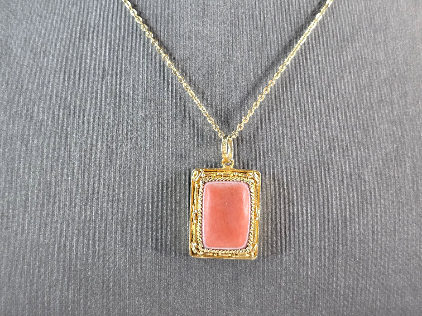 Womens Sterling Silver Gold Tone Coral Pendant Necklace: A WOMENS GOLD TONE STERLING SILVER CORAL PENDANT WITH NECKLACE. THE TOTAL WEIGHT IS 5.6g. PENDANT MEASURES 1" LONG BY 5/8" WIDE, AND NECKLACE IS 18" LONG. MAKES A GREAT GIFT FOR THAT SPECIAL SOMEONE.