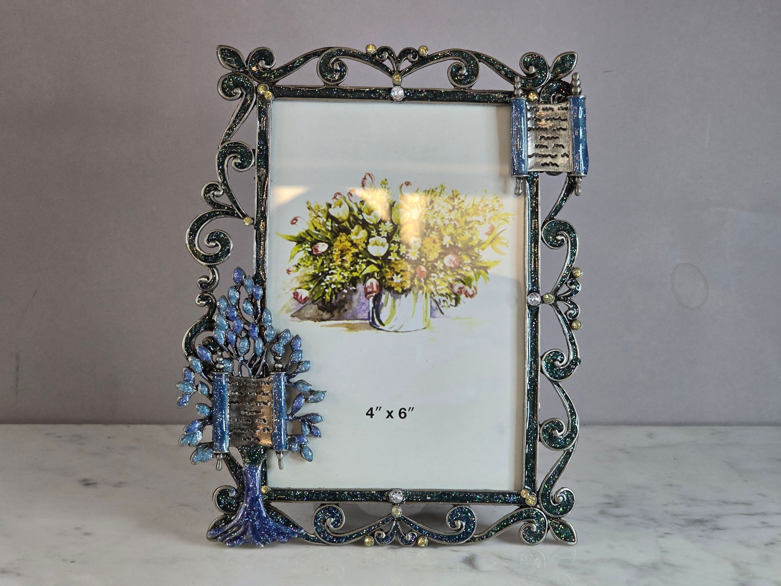 COLLECTIBLE JUDAICA JEWISH ENAMELED TORAH PICTURE FRAME: A decorative Judaica or Jewish enameled Torah picture frame. Frame measures 7 1/4" tall by 5 3/4" wide. Fits a 4" by 6" picture. Shipping and handling is $16 within the Continental U.S. All other