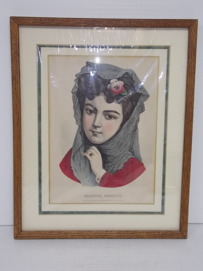 VINTAGE CURRIER & IVES BEAUTIFUL BRUNETTE PRINT: A VINTAGE CURRIER & IVES PRINT ENTITLED BEAUTIFUL BRUNETTE. PRINT MEASURES ABOUT 21" BY 17" WITH THE FRAME. SHIPPING AND HANDLING IS $40 WITHIN THE CONTINENTAL US. ALL OTHER STATES AND COUNTRIES