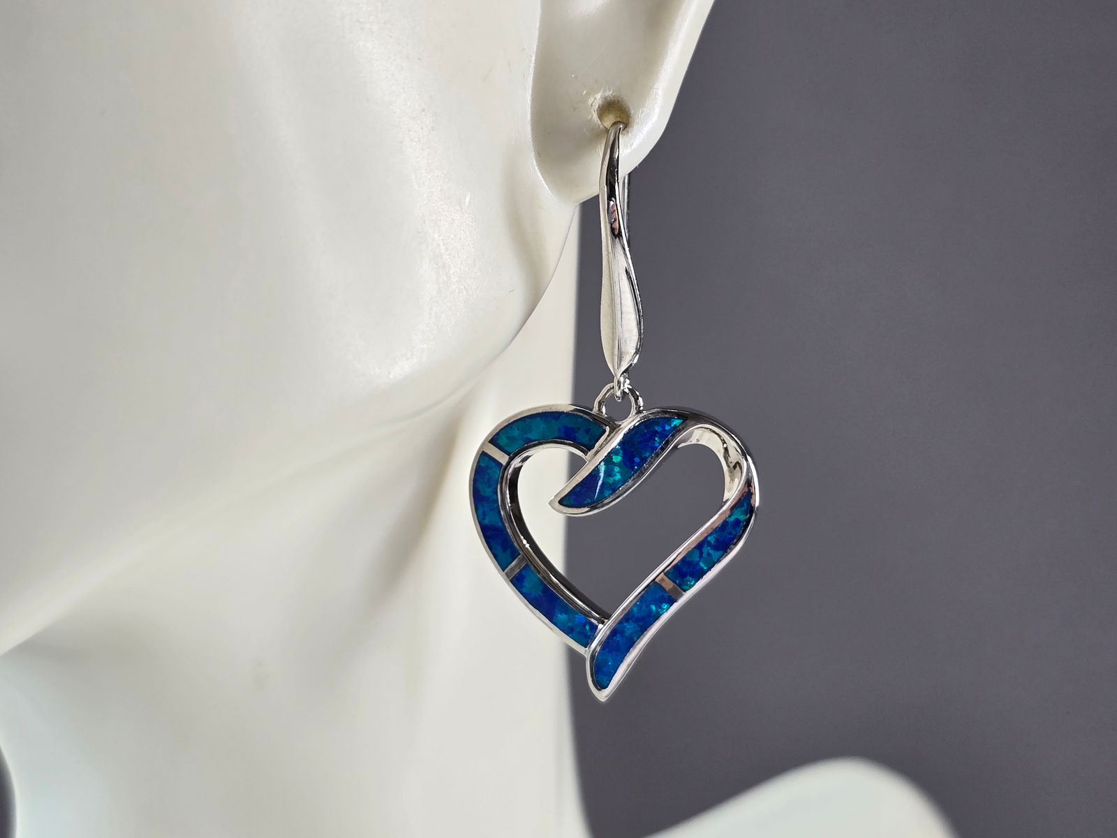 Womens Estate Sterling Silver Blue Opal Heart Earrings: A PAIR OF WOMENS STERLING SILVER BLUE OPAL COLORED HEART EARRINGS THAT WEIGH 8.2g AND MEASURES 1 5/8" LONG BY 7/8" WIDE. NOT SURE IF STONES ARE REAL OR MAN MADE. ANY QUESTIONS, PLEASE DO NOT HESITATE