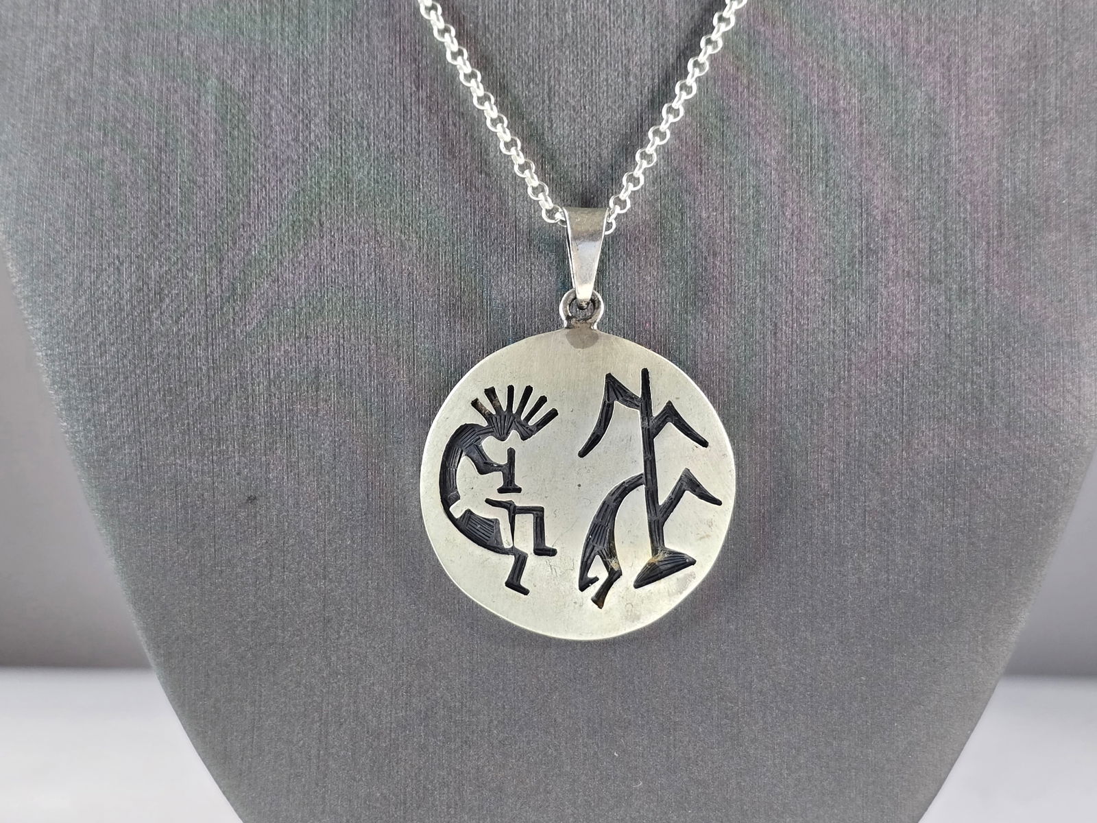 Sterling Silver Necklace W/ Southwestern Kokopelli Pend: A VINTAGE ESTATE .925 STERLING SILVER NECKLACE MADE IN ITALY WITH A SOUTHWESTERN NATIVE AMERICAN STYLE PENDANT WITH KOKOPELLI ON THE FRONT. NECKLACE MEASURES ABOUT 21 3/4" LONG AND THE PENDANT MEASURE