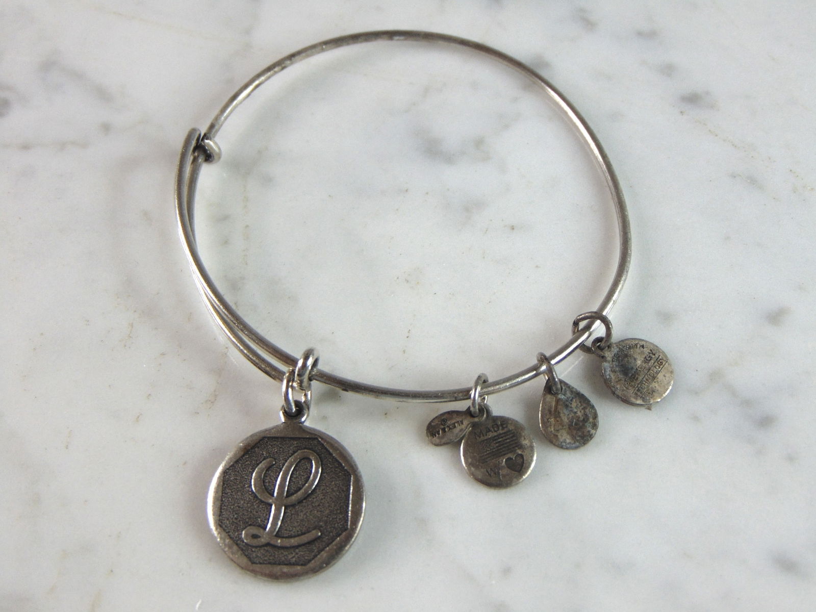 Womens Vintage Estate Alex & Ani "L" Charm Bracelet: FOR SALE IS A LOVELY VINTAGE ESTATE ALEX AND ANI "L" CHARM BRACELET, THAT WEIGHS 11.2g. THE BRACELET IS EXPANDABLE FROM ABOUT 2" TO 3.5". ANY QUESTIONS PLEASE DO NOT HESITATE TO ASK. BE SURE TO CHECK