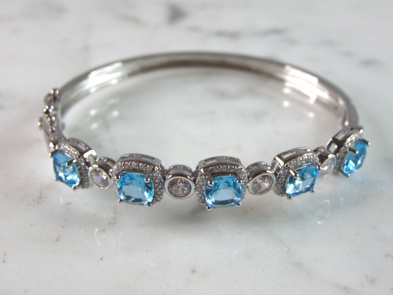 Womens Vintage Estate Sterling Silver Topaz CZ Bangle Bracelet: FOR SALE IS A LOVELY VINTAGE ESTATE .925 STERLING SILVER TOPAZ CZ BANGLE BRACELET. BRACELET OPENING MEASURES 6 1/2" IN CIRCUMFRANCE BY 3/8" WIDE AND WEIGHS 15.1g. BRACELET HAS TOPAZ COLORED STONES. TH