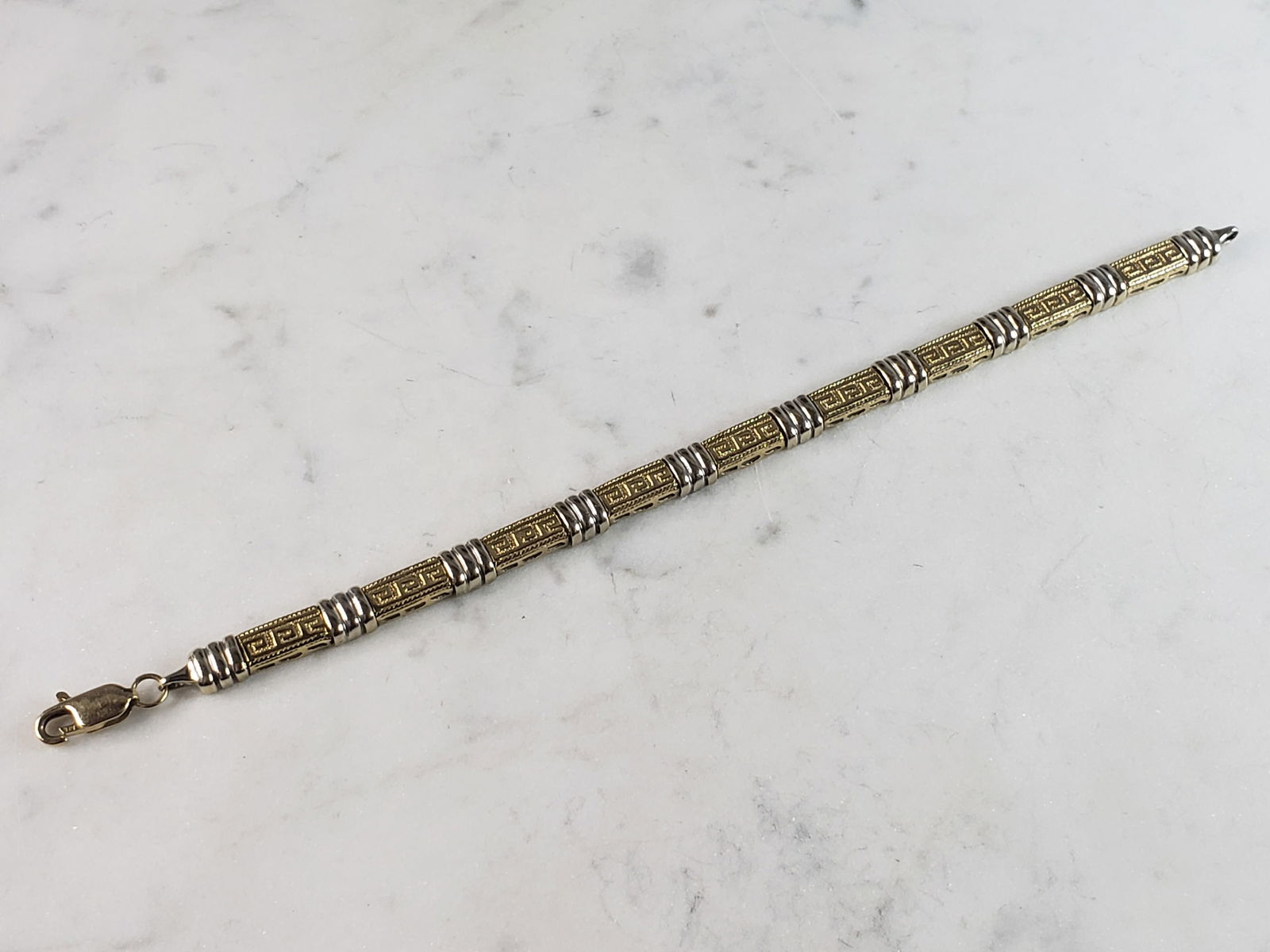 Womens Vintage Estate 14K Gold Greek Key Bracelet: FOR SALE IS A LOVELY VINTAGE ESTATE 14K YELLOW & WHITE GOLD GREEK KEY BRACELET, THAT WEIGHS 14.4g. THE BRACELET MEASURES 7 1/4" LONG BY 1/4" WIDE. BRACELET IS MARKED ON THE CLASP. MAKES A GREAT GIFT F