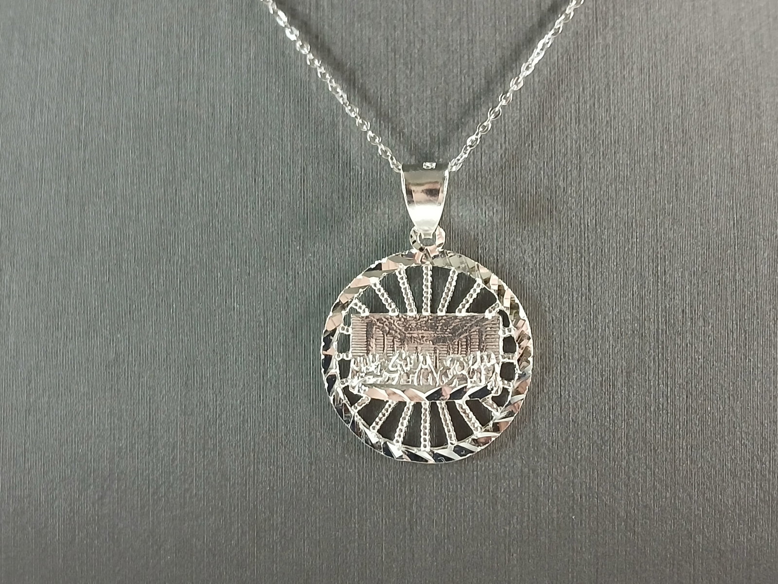 Sterling Silver Religious Last Supper Pendant Necklace: A STERLING SILVER RELIGIOUS LAST SUPPER PENDANT WITH NECKLACE. PENDANT WITH NECKLACE WEIGHS 4.0g. THE PENDANT MEASURES 1 1/4" LONG BY 7/8" WIDE. THE NECKLACE MEASURES 18" LONG AND IS ADJUSTABLE TO 16"