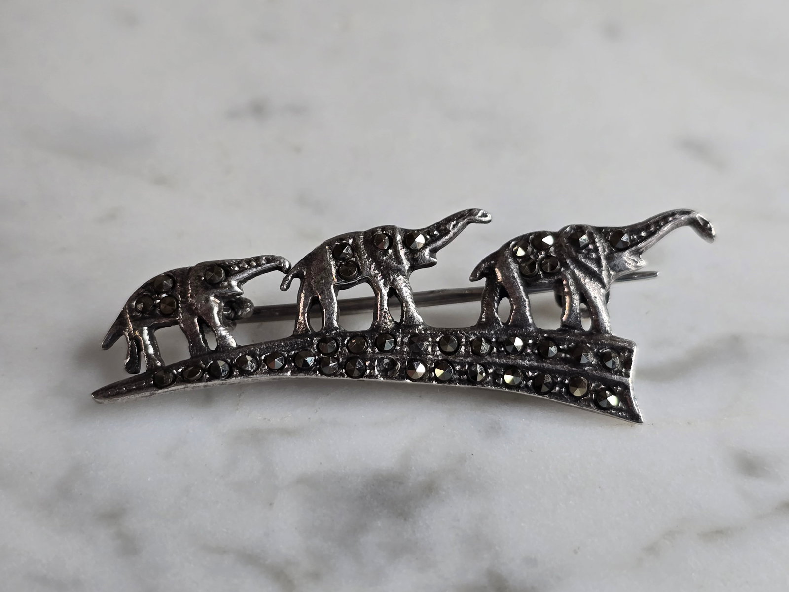 Womens Vintage Estate Sterling Silver Elephant Brooch: A WOMENS VINTAGE ESTATE STERLING SILVER ELEPHANT BROOCH. BROOCH WEIGHS 4.1G, AND MEASURES 1 3/4" BY 5/8". BROOCH IS MISSING ONE TINY STONE. MAKES A GREAT GIFT FOR THAT SPECIAL SOMEONE. ANY QUESTIONS,