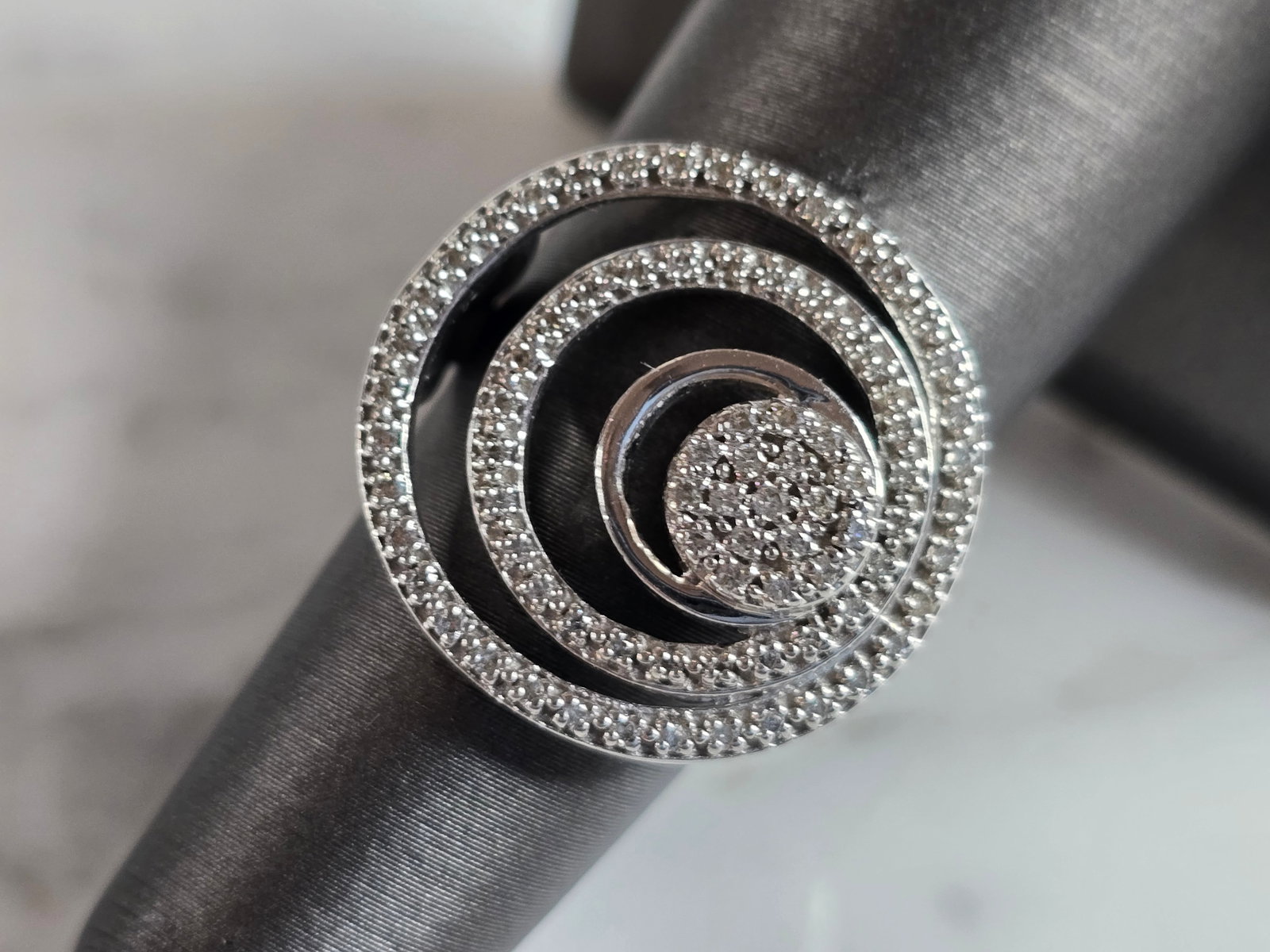 Womens Vintage Estate 14K White Gold Diamond Modernist Ring: A WOMENS VINTAGE ESTATE 14K WHITE GOLD DIAMOND MODERNIST RING. THE RING IS A SIZE 6.5, AND WEIGHS 7.7g. THERE ARE ABOUT 81 DIAMONDS IN THIS RING. THE WIDTH OF THE RING IS 3/4". RING MAKES A BEAUTIFUL