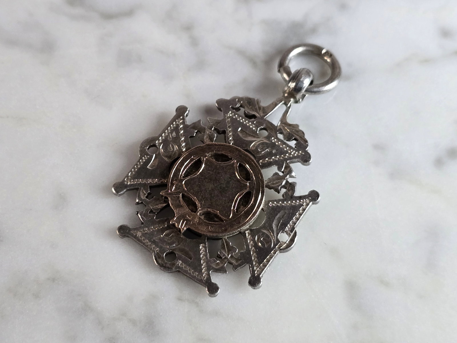 Antique English Sterling Silver Watch Fob Medal: AN ANTIQUE ENGLISH STERLING SILVER WATCH FOB MEDAL THAT IS BELIEVED TO BE MADE BY WILLIAM HAIR, 1898. FOB WEIGHS 10.2g, AND MEASURES 1 3/4" BY 1 1/8". THIS WOULD MAKE A NICE GIFT FOR THAT SOMEONE SPEC