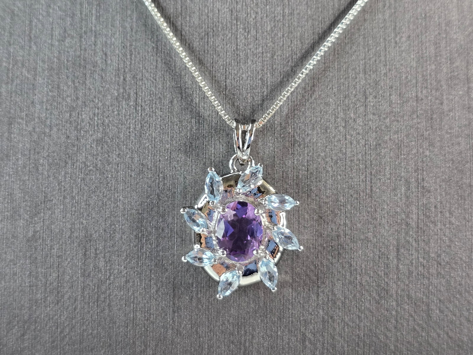 Womens Estate Sterling Silver Amethyst Topaz Pendant Necklace: A WOMENS VINTAGE ESTATE STERLING SILVER AMETHYST & TOPAZ STONE PENDANT WITH NECKLACE. TOGETHER NECKLACE AND PENDANT WEIGHS 6.0g. PENDANT MEASURES 1" LONG BY 3/4" WIDE. NECKLACE MEASURES 18". NOT SURE