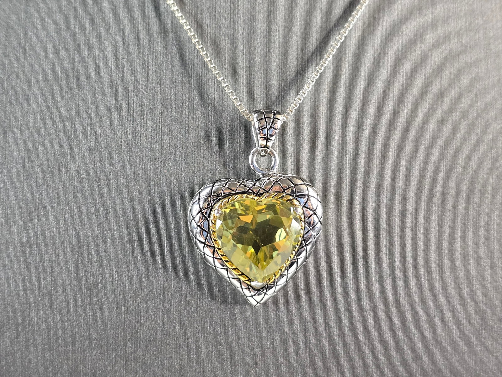 Womens Vintage Estate Sterling Silver Citrine Heart Pendant Necklace: A WOMENS VINTAGE ESTATE STERLING SILVER NECKLACE WITH A CITRINE HEART PENDANT. THE PENDANT MEASURES 1 1/4" BY 7/8". THE NECKLACE MEASURES 18" LONG. TOGETHER THEY WEIGH 9.1g. NOT SURE IF THE STONE IS N