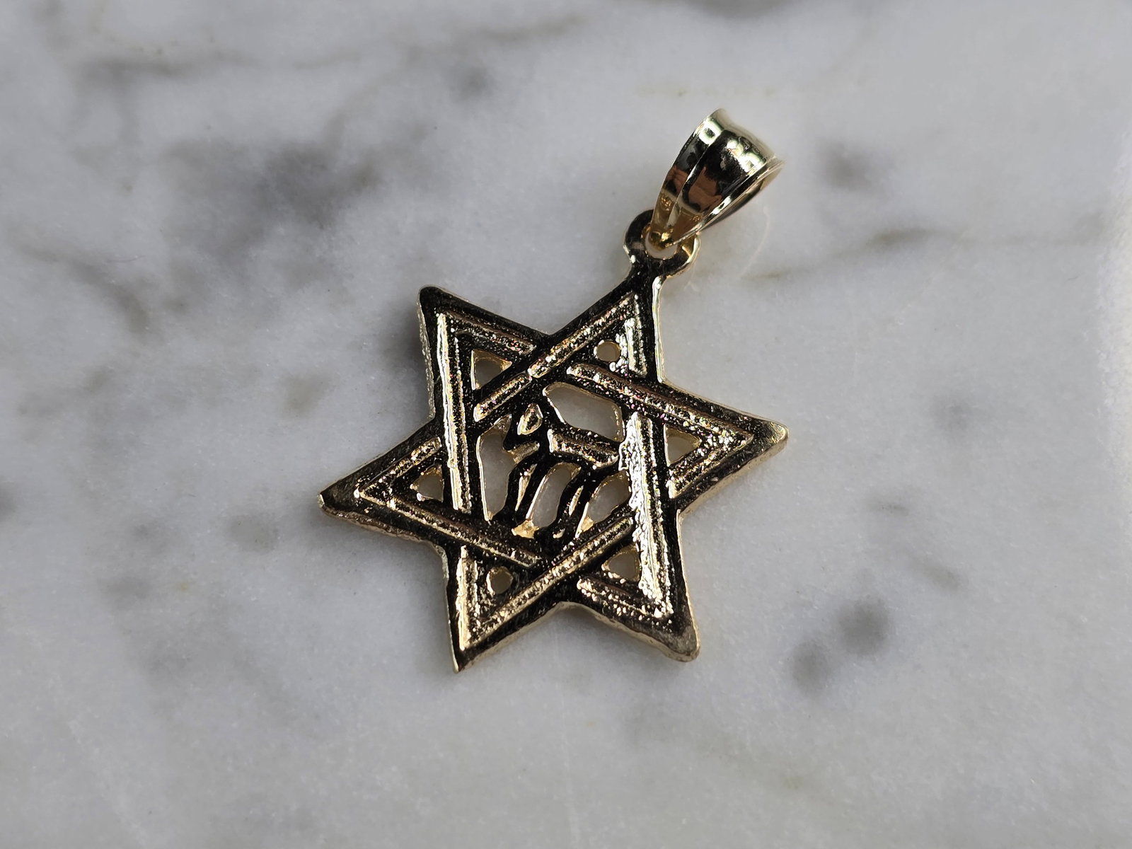 14K Yellow Gold Jewish Judaica Star of David Chai Pendant: A 14K YELLOW GOLD JUDAICA STAR OF DAVID CHAI PENDANT. THE PENDANT WEIGHS 2.1g, AND MEASURES 1 1/8" LONG BY 3/4" WIDE. MAKES A GREAT GIFT FOR THAT SOMEONE SPECIAL. ANY QUESTIONS, PLEASE ASK. BE SURE TO