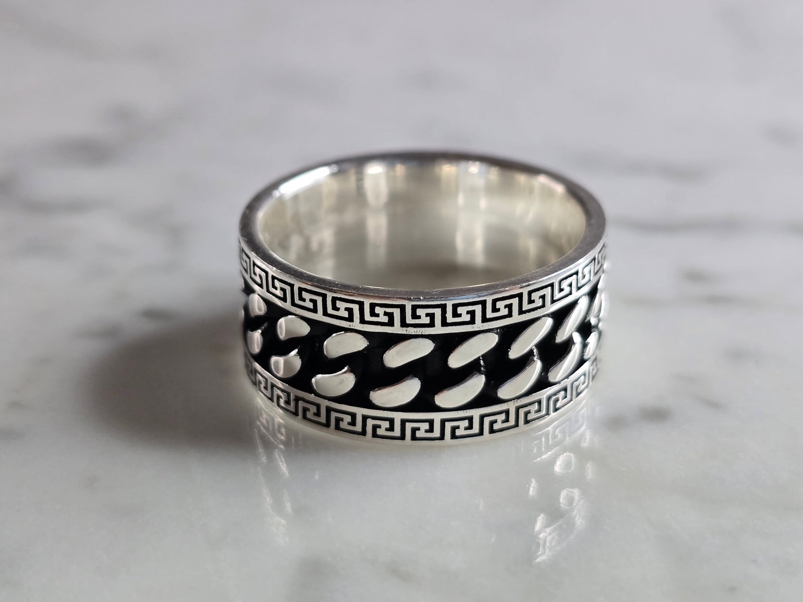 Mens Estate Sterling Silver Band Ring: A MENS ESTATE STERLING SILVER GREEK KEY BAND RING. THE RING WEIGHS 10.7g AND IS A SIZE 11.0. BAND MEASURES 1/2" WIDE. THIS RING WOULD BE A WONDERFUL GIFT FOR THAT SPECIAL SOMEONE. ANY QUESTIONS PLEASE