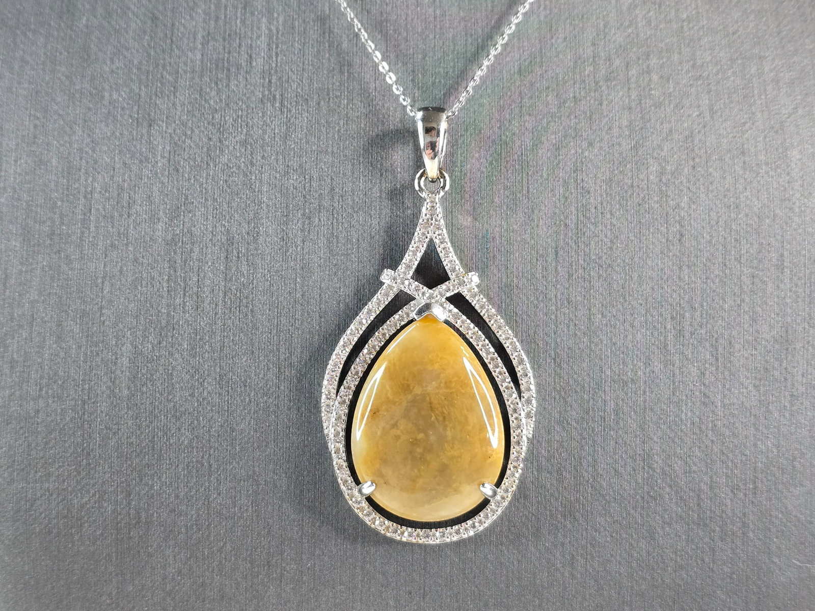 Womens Sterling Silver Modernist Calcite CZ Pendant Necklace: A WOMEN STERLING SILVER NECKLACE WITH WHAT APPEARS TO BE A CALCITE & CZ PENDANT. THE PENDANT MEASURES 1 1/4" BY 2 3/8". THE NECKLACE MEASURES 18" LONG. TOGETHER THEY WEIGH 16.7g. NOT SURE IF THE STONE