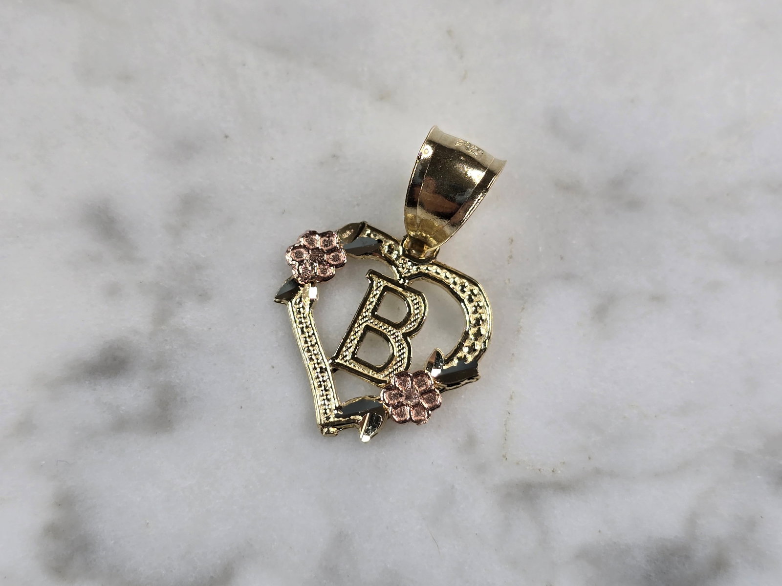 Womens 10K Yellow & Rose Gold Initial Letter " B " Heart Pendant: A WOMENS 10K YELLOW & ROSE GOLD "B" HEART PENDANT. PENDANT MEASURES 3/4" LONG BY 5/8" WIDE. TOTAL WEIGHT OF THE PENDANT IS 0.9g. WOULD MAKE A LOVELY GIFT FOR THAT SOMEONE SPECIAL. ANY QUESTIONS PLEASE