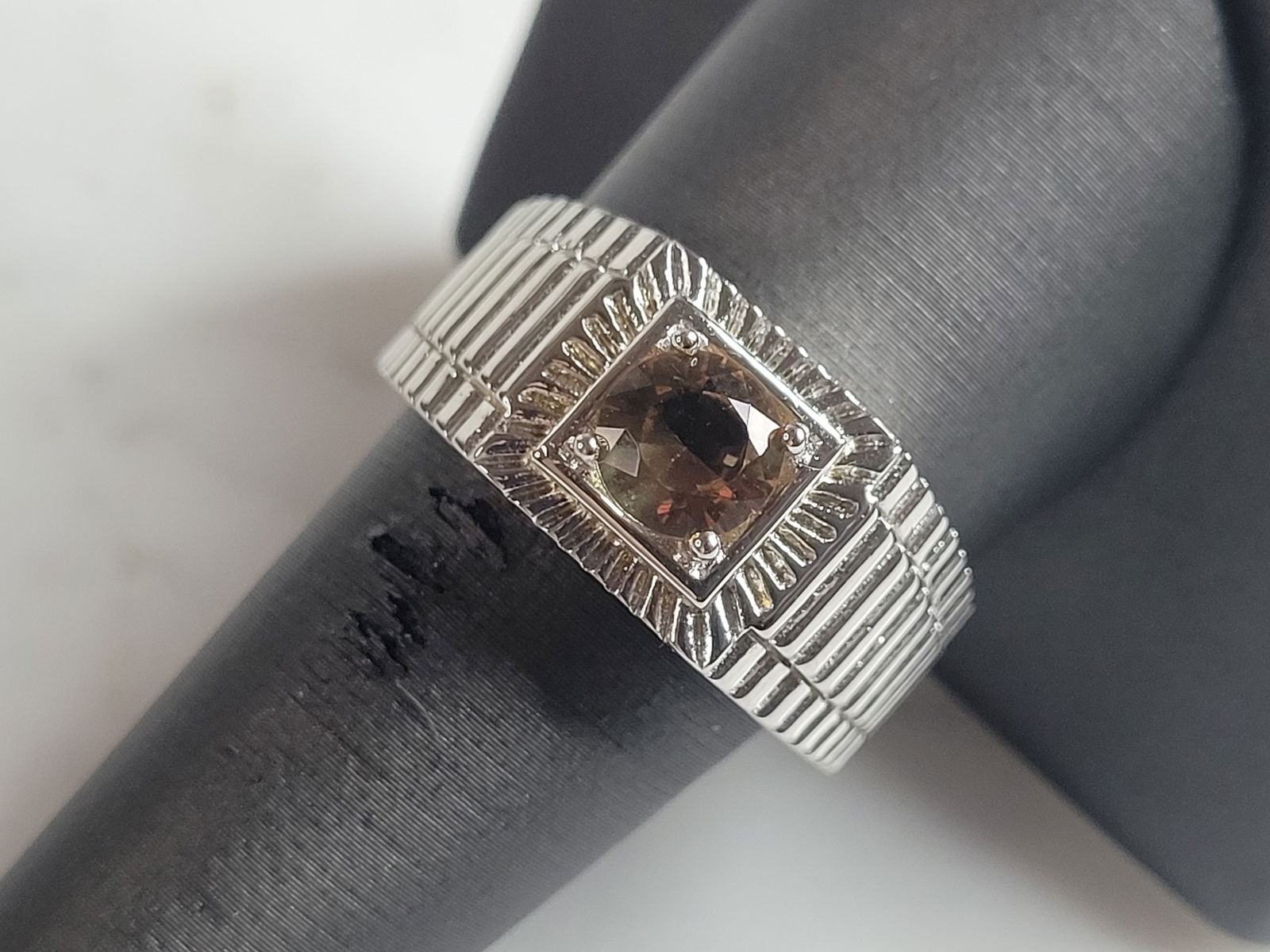 Mens Estate Sterling Silver Modernist Citrine Ring: A MENS ESTATE STERLING SILVER MODERNIST RING. THE RING IS A SIZE 10.0 AND WEIGHS 10.0g. STONE IS A CITRINE COLORED GLASS. WIDTH OF THE RING IS ABOUT 7/16". THE RING MAKES A BEAUTIFUL, IMPRESSIVE GIFT