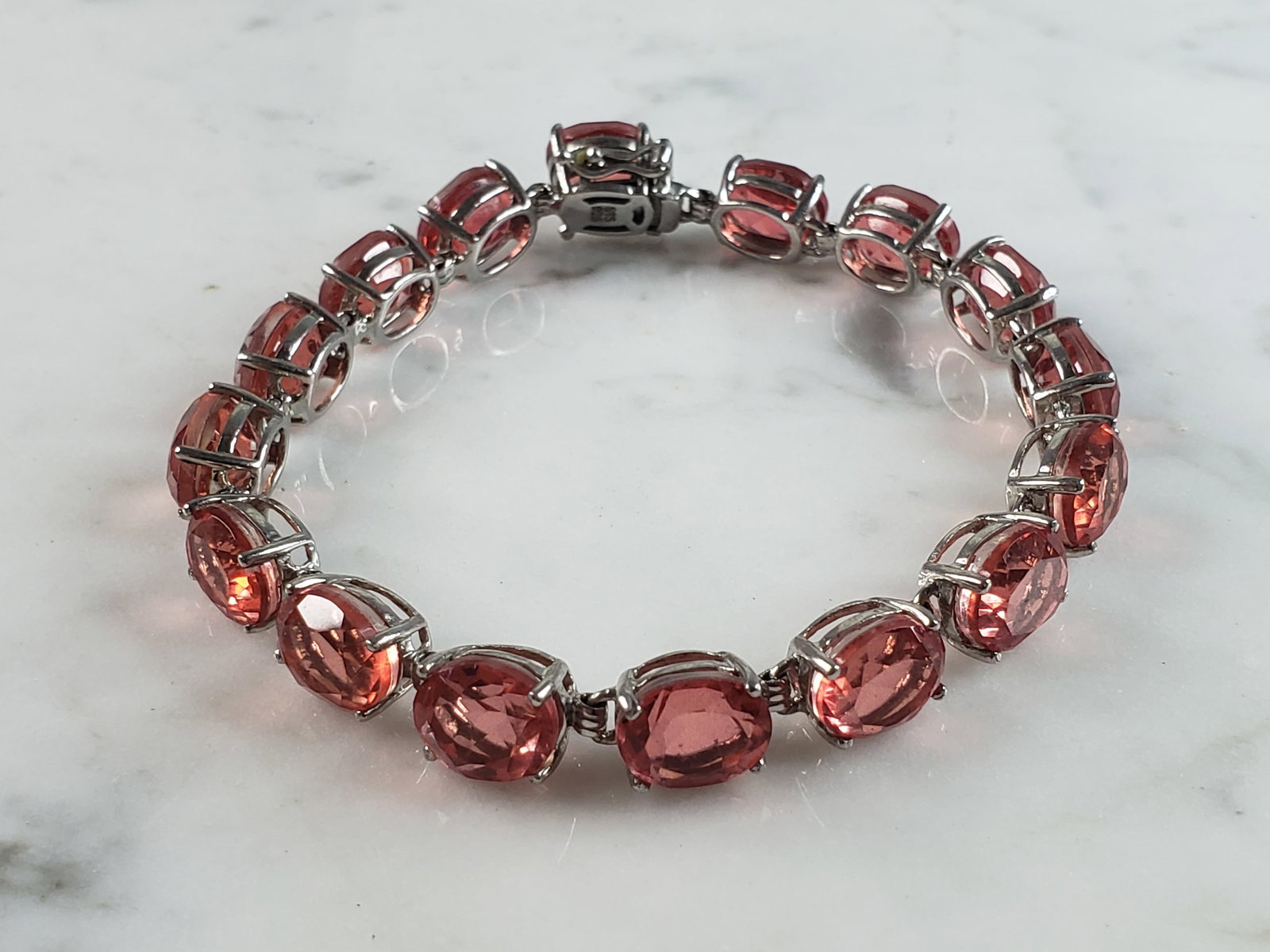 Womens Vintage Estate Sterling Silver Rose Quartz Colored Bracelet: FOR SALE IS A WOMENS VINTAGE ESTATE .925 STERLING SILVER ROSE QUARTZ COLORED BRACELET. NOT SURE IF STONES ARE NATURAL OR MAN MADE. BRACELET MEASURES 8 1/8" LONG BY 3/8" WIDE AND WEIGHS 22.0g. THIS WOU