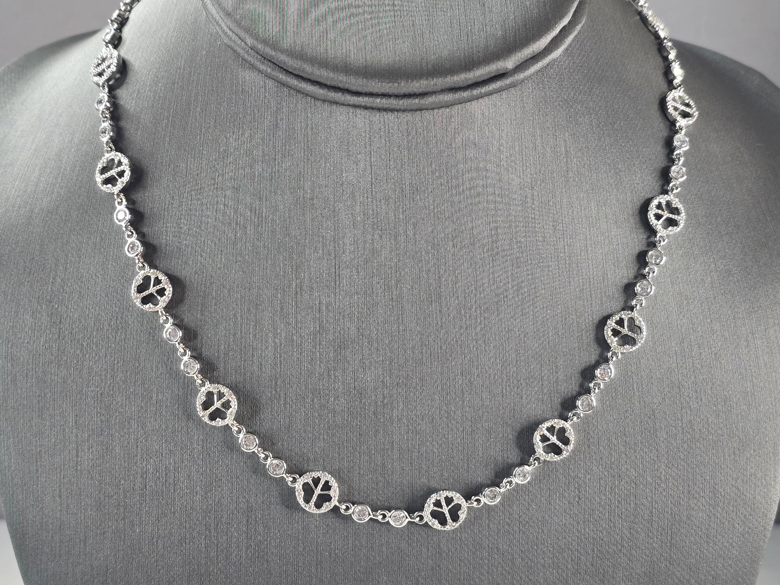 Womens Sterling Silver CZ Peace Symbol Necklace: A WOMENS STERLING SILVER CZ PEACE SYMBOL NECKLACE. THE TOTAL WEIGHT IS 15.7g. NECKLACE MEASURES 18" LONG BY 5/16". MAKES A GREAT GIFT FOR THAT SPECIAL SOMEONE. ANY QUESTIONS PLEASE DONT HESITATE TO AS