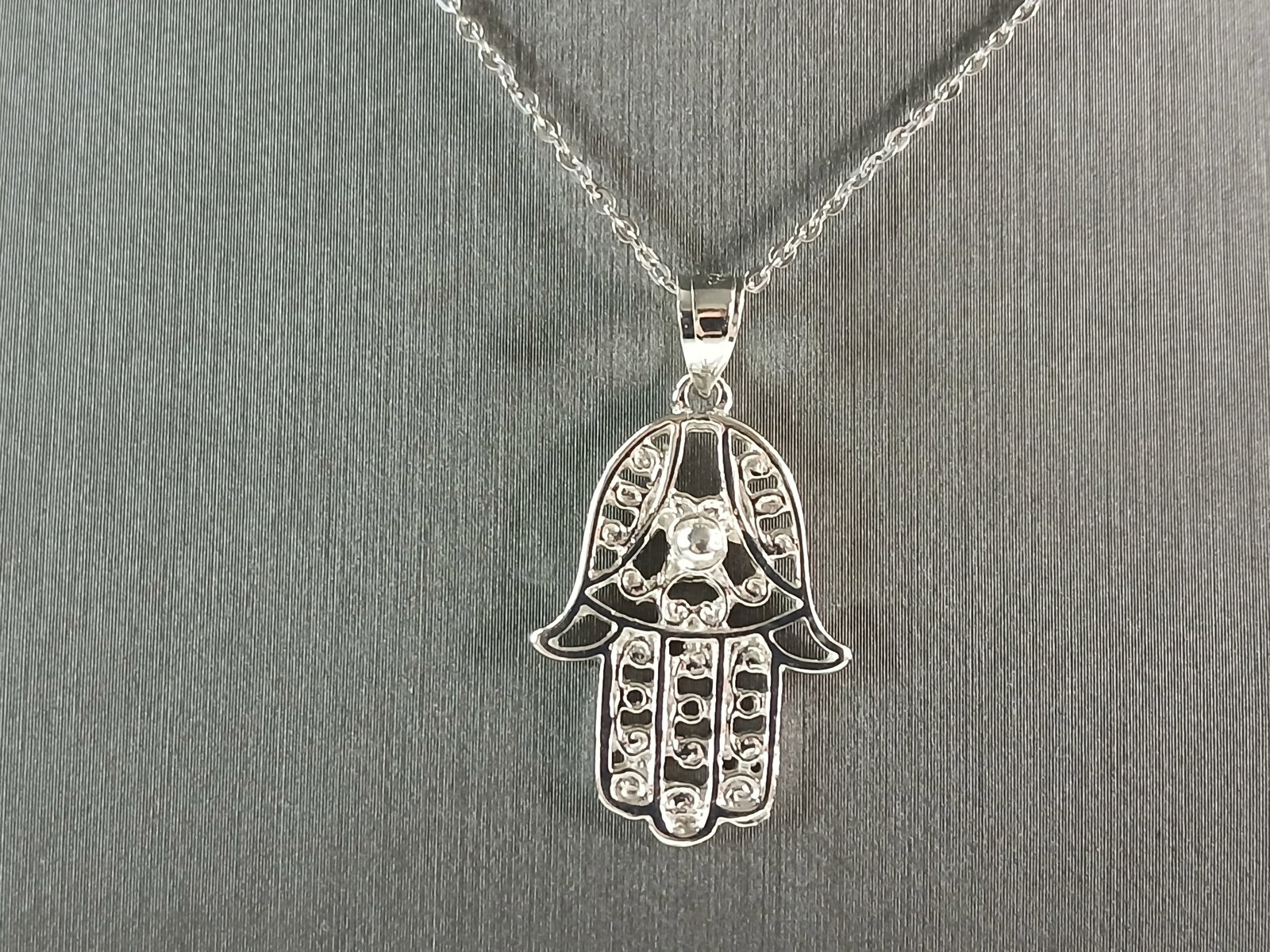 Womens Sterling Silver Hamsa Hand Pendant Necklace: A WOMENS STERLING SILVER HAMSA HAND PENDANT WITH NECKLACE. THE PENDANT WITH NECKLACE WEIGHS 4.3g. THE PENDANT MEASURES 1 1/4" BY 5/8", AND THE NECKLACE MEASURES 18" LONG. MAKES A GREAT GIFT FOR THAT S