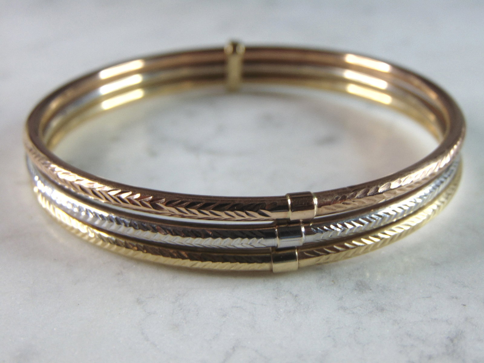 Womens Vintage Estate 14K Multi-Tone Gold Bangle Bracelet: FOR SALE A LOVELY VINTAGE ESTATE 14K MULTI-TONE GOLD BANGLE BRACELET. INNER CIRCUMFRENCE MEASURES 6 3/4" BY 3/8" WIDE , AND WEIGHS 10.6g. THIS WOULD MAKE A LOVELY GIFT FOR THAT SOMEONE SPECIAL. ANY QU