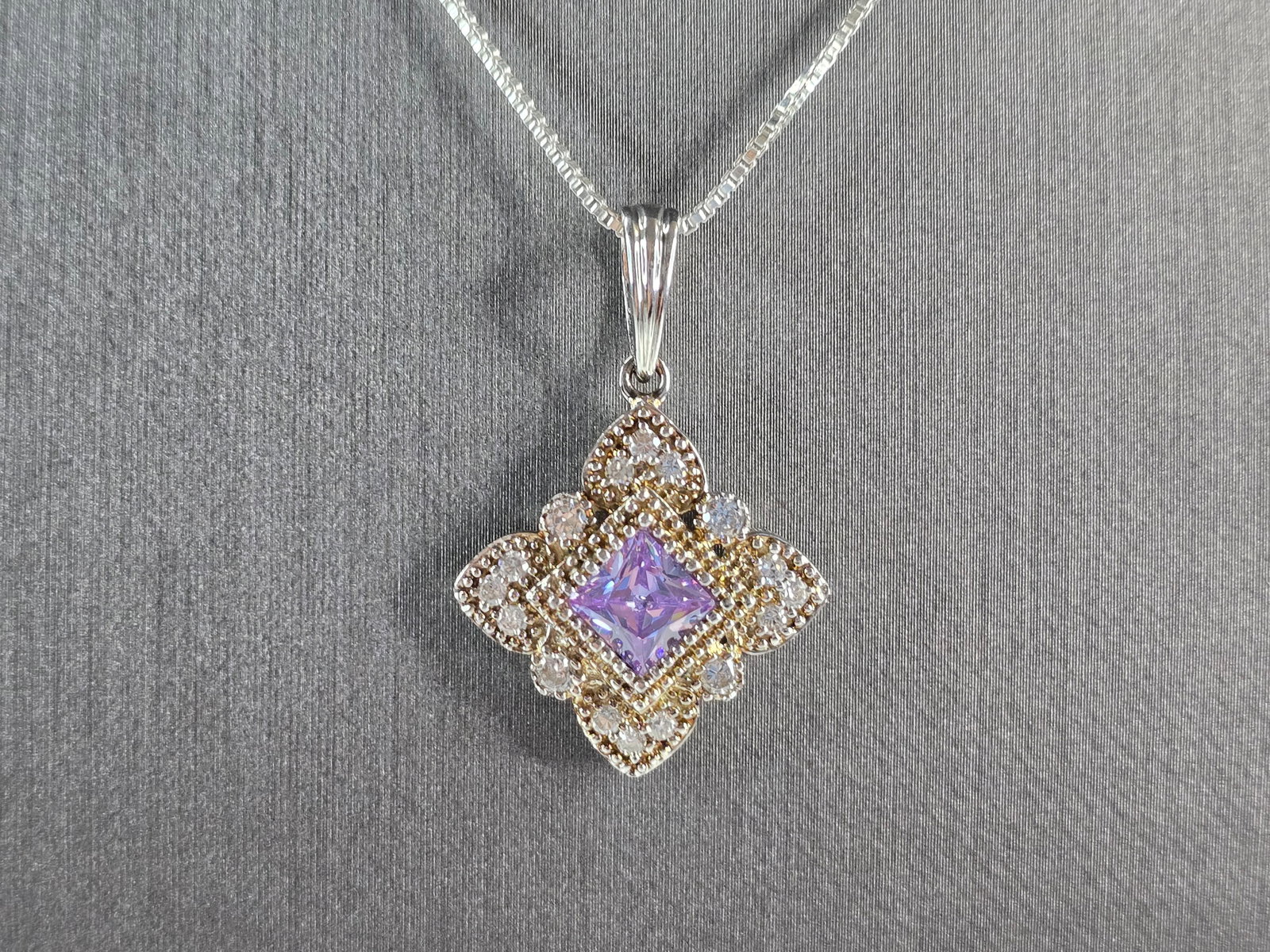 Womens Estate Sterling Silver Amethyst CZ Pendant w/ Necklace: A WOMENS VINTAGE ESTATE STERLING SILVER AMETHYST COLORED STONE PENDANT WITH NECKLACE. TOGETHER NECKLACE AND PENDANT WEIGHS 6.8g. PENDANT MEASURES 1 1/4" LONG BY 7/8" WIDE. NECKLACE MEASURES 18". NOT S