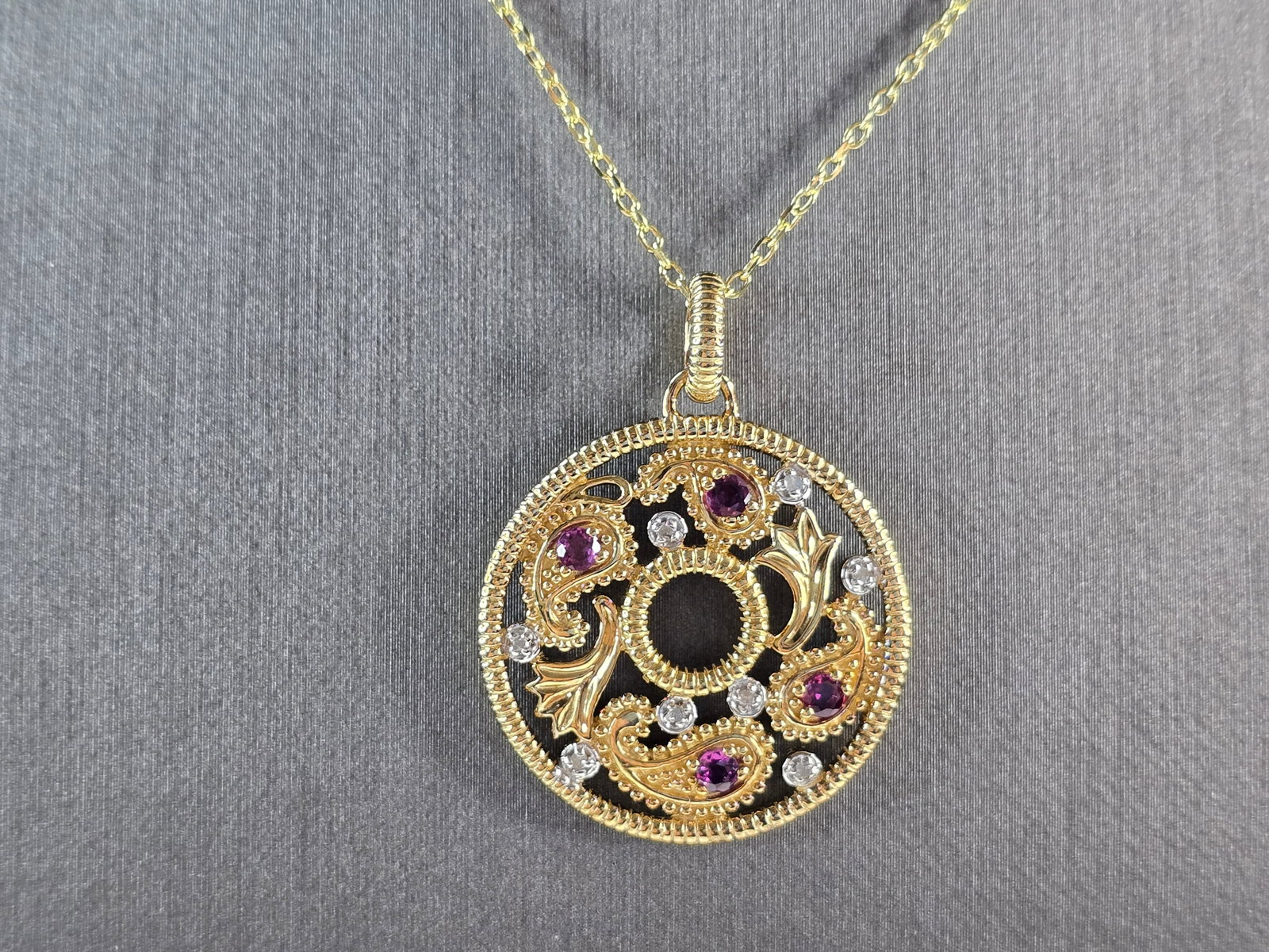 Womens Sterling Silver Gold Tone Amethyst Pendant Necklace: A WOMENS GOLD TONE STERLING SILVER AMETHYST PENDANT WITH NECKLACE. THE TOTAL WEIGHT IS 5.8g. PENDANT MEASURES 1" LONG BY 3/4" WIDE, AND NECKLACE IS 17 3/4" LONG. NOT SURE IF THE STONES ARE NATURAL OR