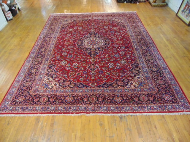 Vintage Estate Semi-Antique Handmade Kashan Rug: A BEAUTIFUL SEMI ANTIQUE HAND MADE HAND KNOTTED KASHAN RUG THAT MEASURES 13'5"BY 10'4". RUG IS MADE FROM 100% WOOL. CONDITION IS GOOD. APPRAISED $22,000