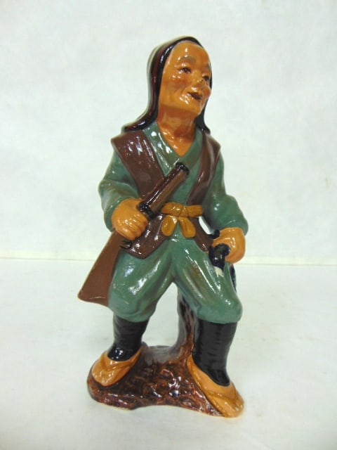 VINTAGE JAPANESE MUDMAN HUNTER FIGURE: A VINTAGE COLLECTIBLE JAPANESE MUDMAN FIGURE OF A HUNTER. THE FIGURE MEASURES 9" TALL BY 4" LONG. CONDITION APPEARS TO BE GREAT. AS YOU CAN SEE IT STILL HAS ITS ORIGINAL TAG. PIECE APPEARS TO BE MADE