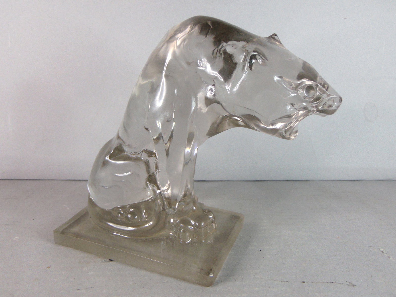 Vintage Decorative Signed Steuben Crystal Lion Figure: A VINTAGE DECORATIVE SIGNED STEUBEN CRYSTAL LION FIGURE THAT MEASURES 6 3/4" TALL BY 7 1/2" LONG BY 3 1/2" WIDE. PIECE IS SIGNED BY FREDRICK CARDER, WHO WAS THE CO-FOUNDER OF STEUBEN. LION IS IN GREAT