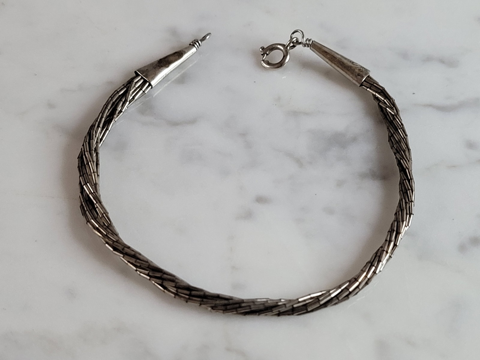 Womens Vintage Estate Twisted Sterling Silver Bracelet: A WOMENS VINTAGE ESTATE TWISTED STERLING SILVER BRACELET. BRACELET MEASURES 7 1/4" LONG BY 1/4" WIDE. BRACELET WEIGHS 4.2g. THIS WOULD MAKE A LOVELY GIFT FOR THAT SOMEONE SPECIAL. ANY QUESTIONS PLEASE