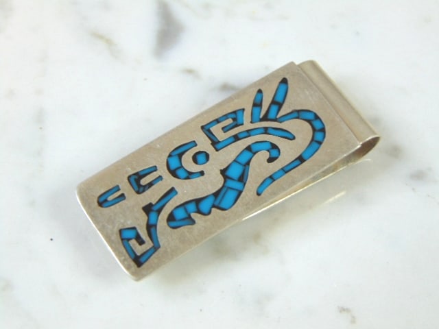 Sterling Silver Southwestern Money Clip w/ tourquise: FOR SALE IS THIS STERLING SILVER SOUTHWESTERN STYLE MONEY CLIP INLAID WITH TURQUOISE IN THE FORM OF KOKOPELLI. THE MONEY CLIP WEIGHS 22.3g, AND IS 2" LONG BY 7/8" WIDE. ANY QUESTIONS PLEASE DO NOT HES