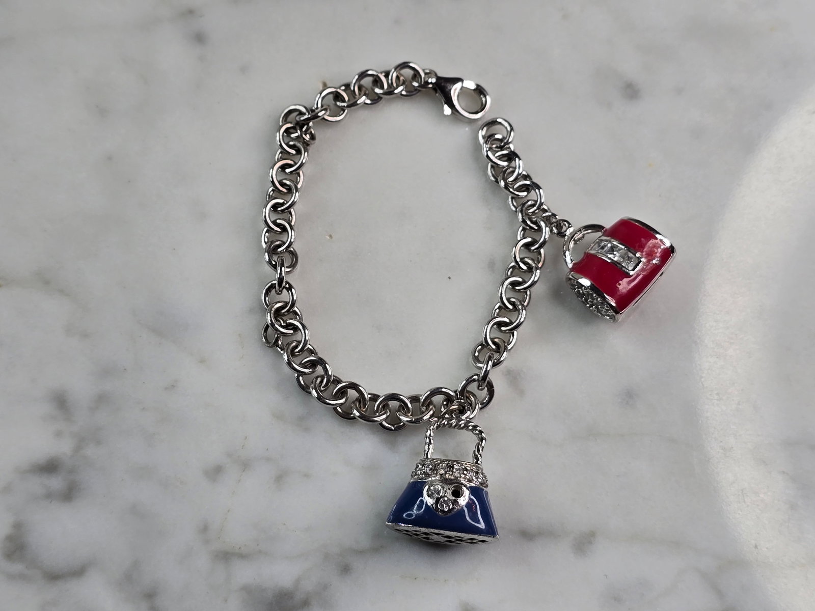 Womens Vintage Sterling Silver Charm Purse Bracelet: THIS ITEM IS A LOVELY VINTAGE STERLING SILVER PURSE CHARM BRACELET. BRACELET IS ABOUT 5 3/4" LONG BY 1/4" WIDE, AND WEIGHS 14.2g. IT WOULD MAKE A GREAT GIFT FOR ANYONE SPECIAL IN YOUR LIFE. BE SURE TO