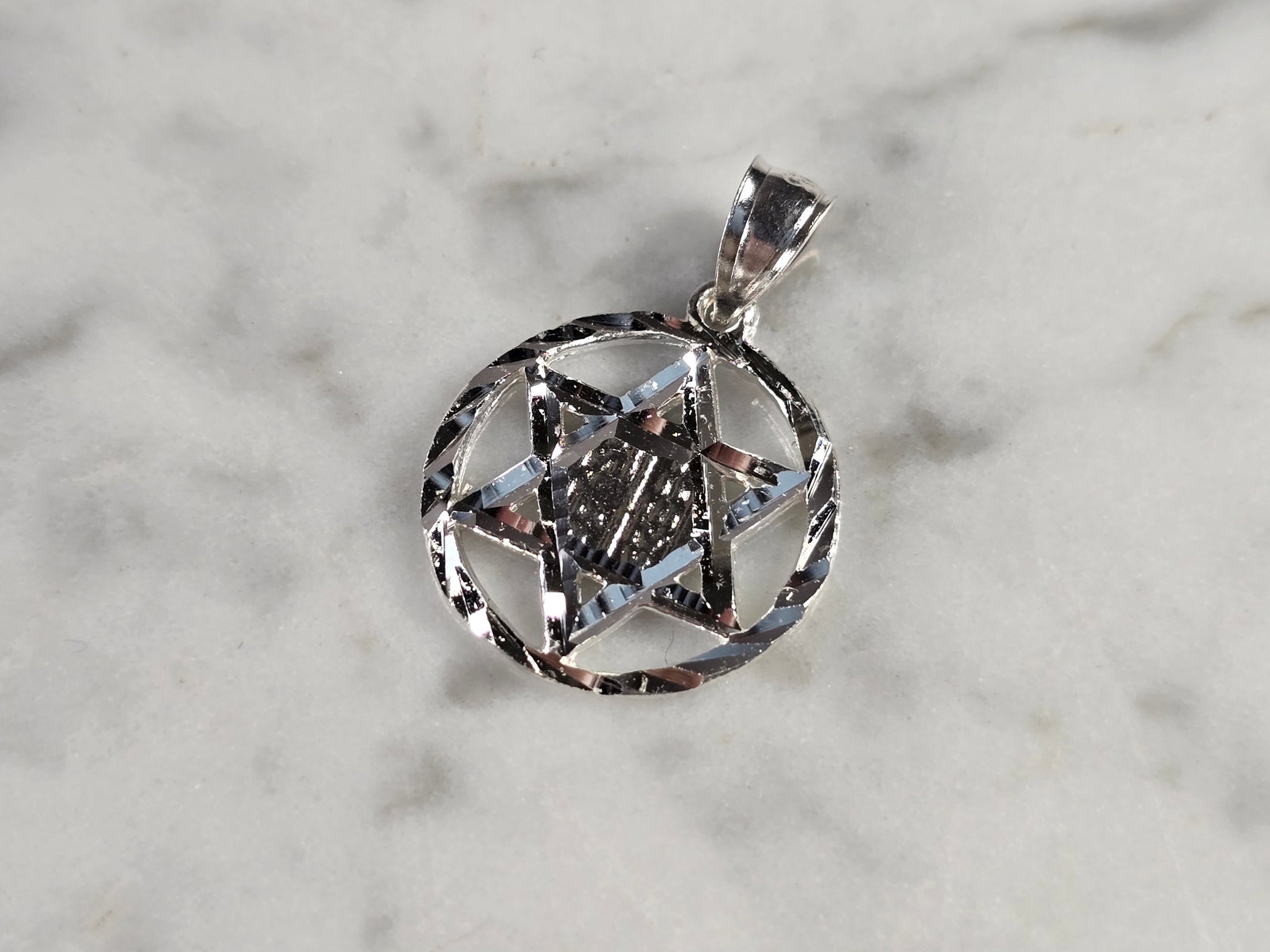 Sterling Silver Jewish Judaica Star of David Religious Pendant: A STERLING SILVER STAR OF DAVID PENDANT. THE PENDANT WEIGHS 1.6g AND MEASURES 7/8" LONG BY 5/8" WIDE. MAKES A GREAT GIFT FOR THAT SOMEONE SPECIAL. ANY QUESTIONS, PLEASE ASK. BE SURE TO CHECK OUT OUR O