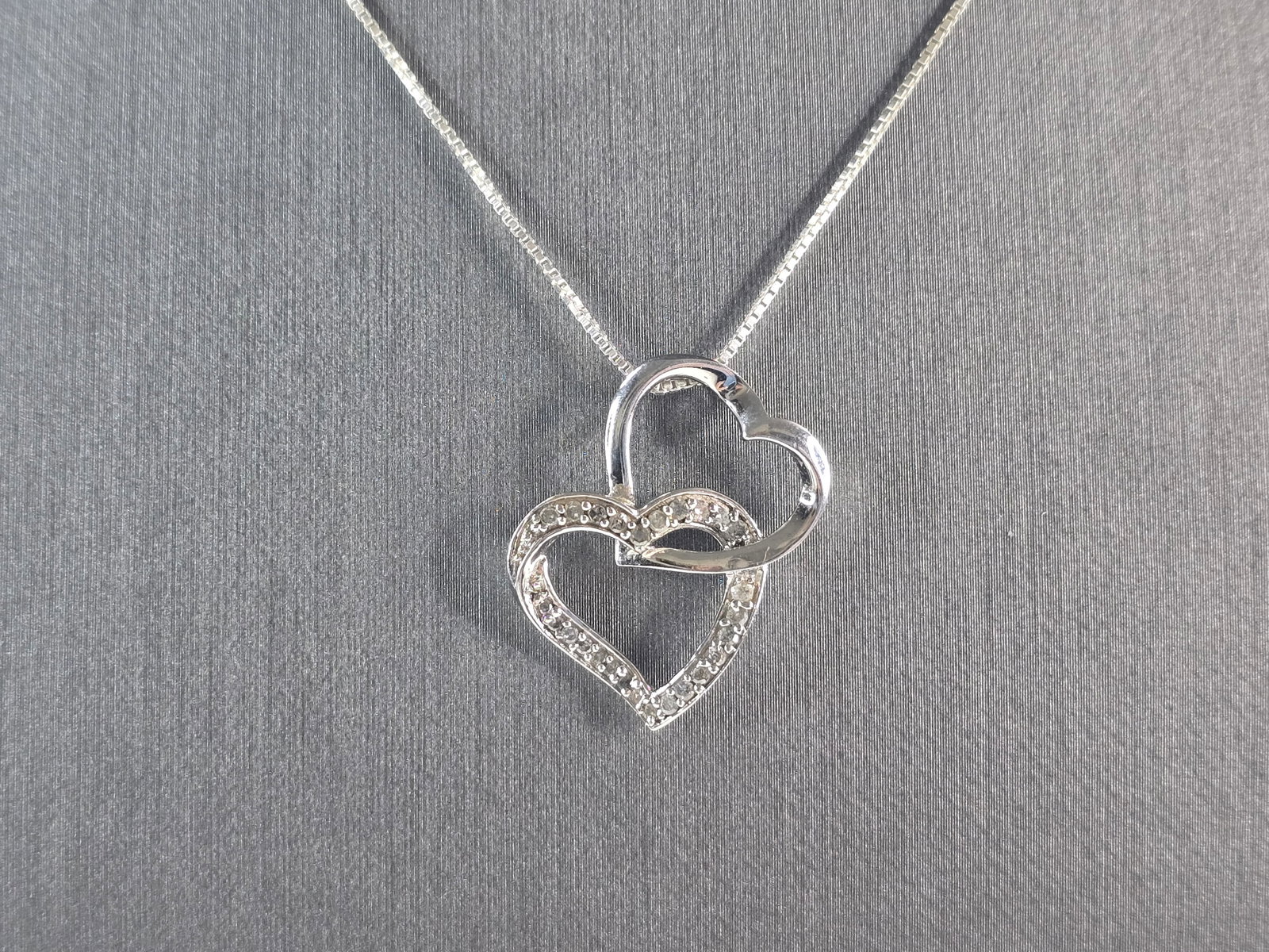 Womens Vintage Estate Sterling Silver Diamond Heart Pendant Necklace: A WOMENS VINTAGE ESTATE STERLING SILVER DIAMOND HEART PENDANT WITH NECKLACE. THE TOTAL WEIGHT IS 3.6g. THE NECKLACE MEASURES 18 1/4" LONG AND THE PENDANT MEASURES 1" BY 7/8". THERE ARE 27 TINY DIAMOND