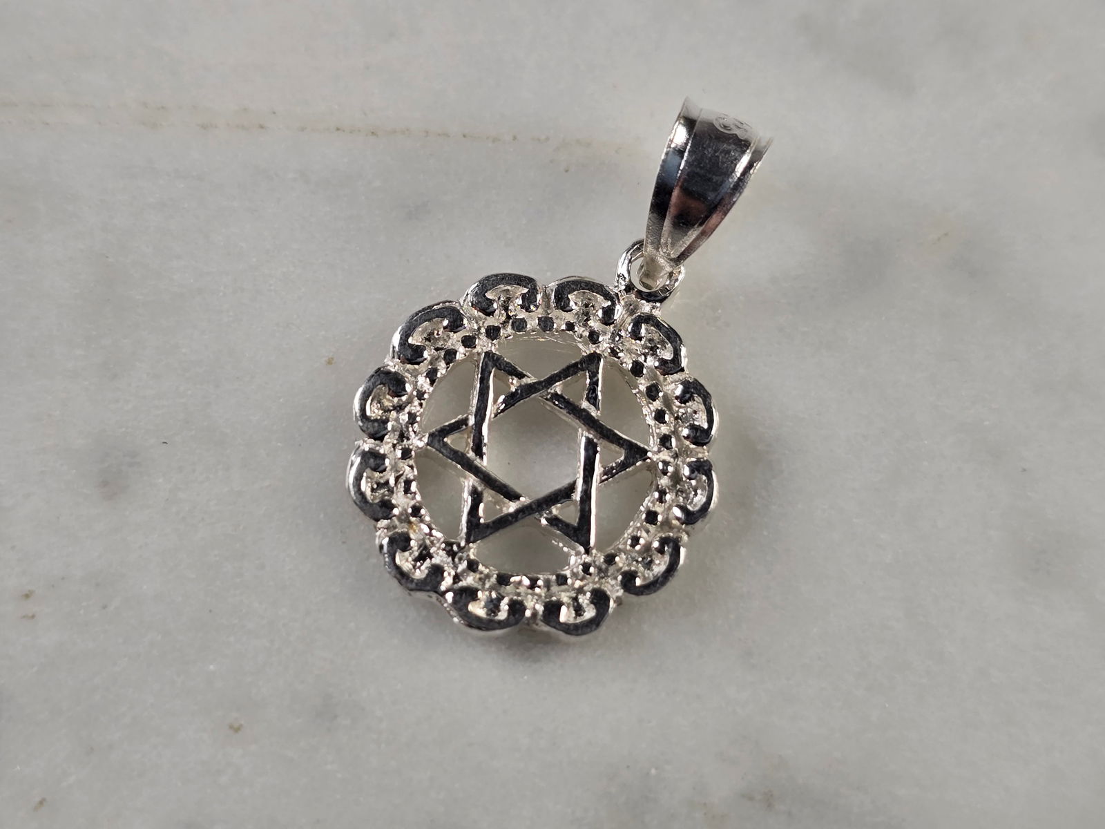 Sterling Silver Jewish Judaica Star of David Pendant: A STERLING SILVER STAR OF DAVID PENDANT THAT WEIGHS 1.2g, AND MEASURES 3/4" LONG BY 1/2" WIDE. MAKES A GREAT GIFT FOR THAT SOMEONE SPECIAL. ANY QUESTIONS, PLEASE ASK. BE SURE TO CHECK OUT OUR OTHER IT